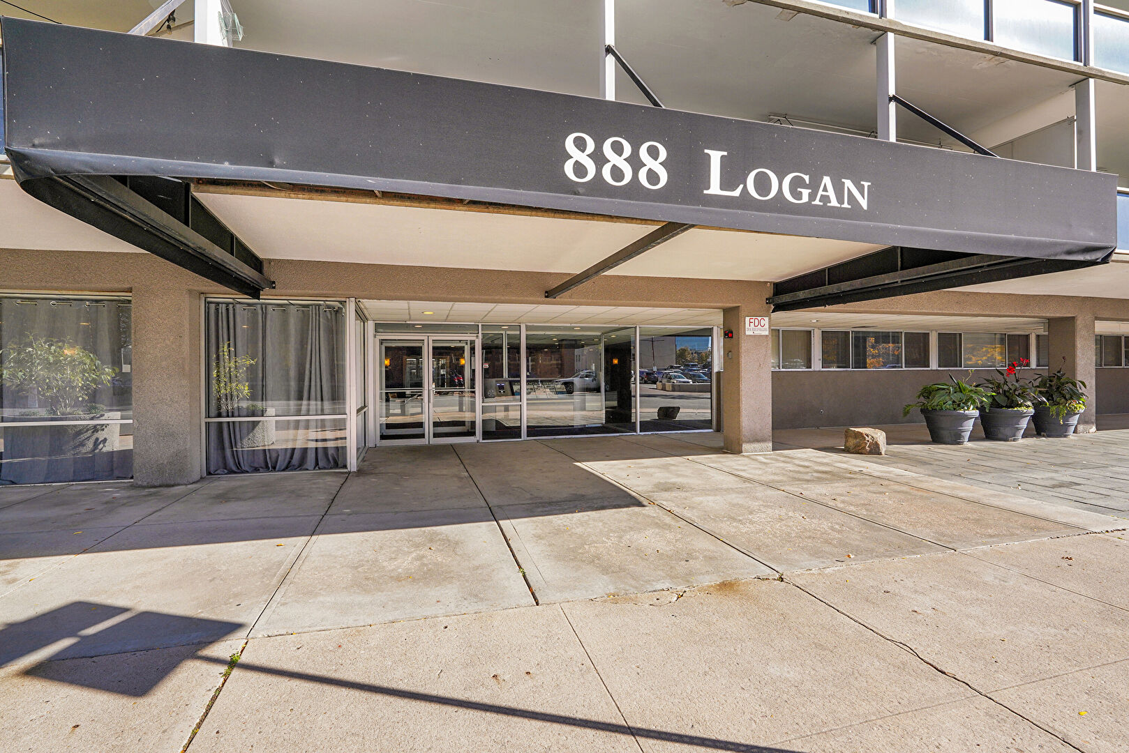 Front at 888 Logan Street, Denver, CO 80203, listed by Taylor Haas