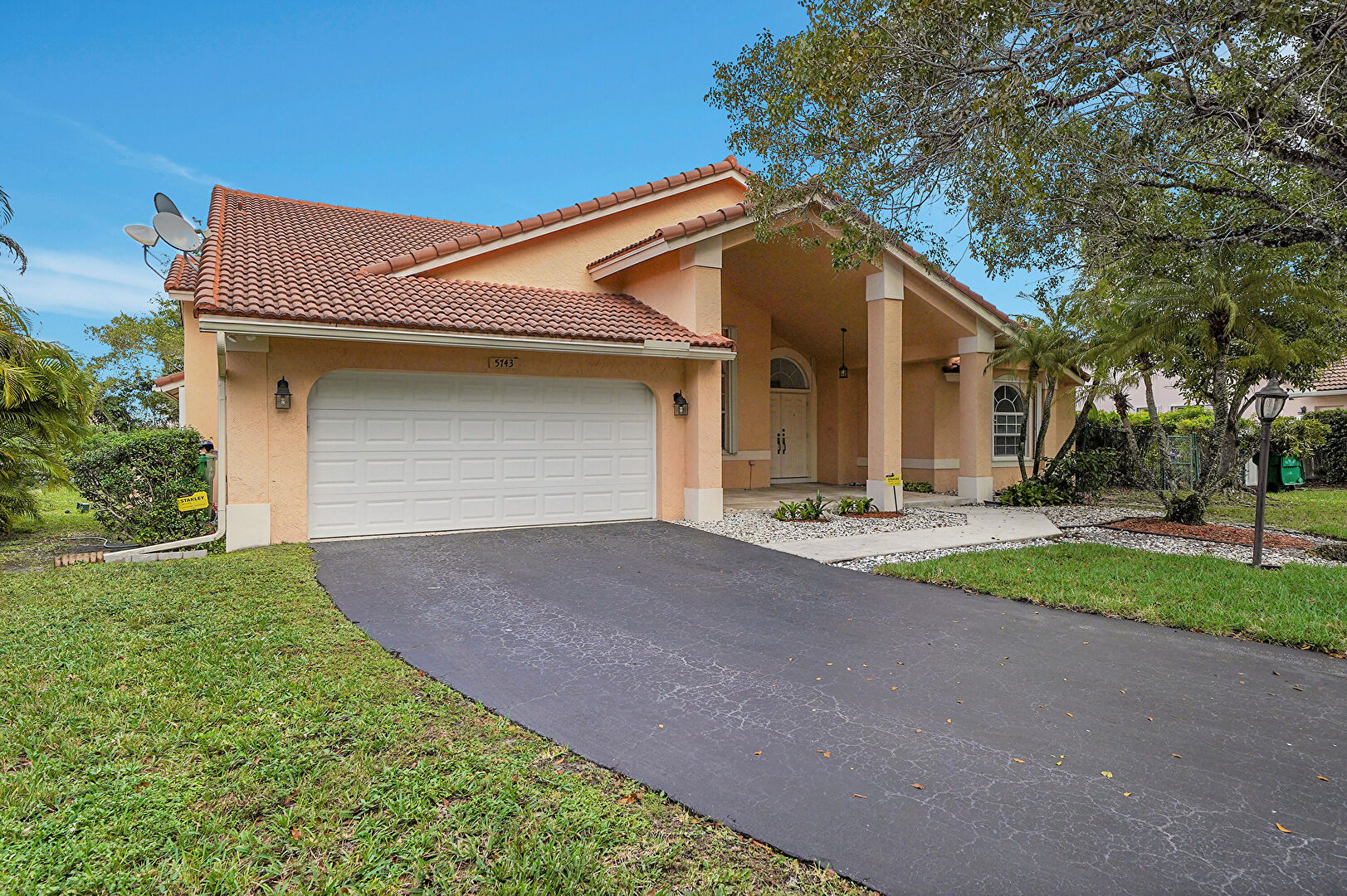 Front at 5743 Northwest 100th Way, Coral Springs, FL 33076, listed by Charilee Rivera