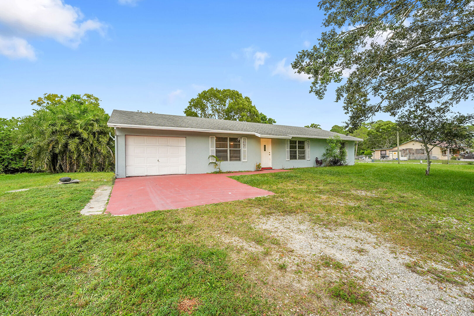 Front at 13399 53rd Court North, West Palm Beach, FL 33411, listed by Larry Mastropieri