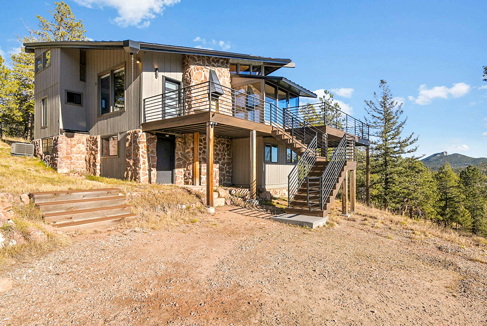 Front at 11845 US Highway 285, Conifer, CO 80433, listed by Sandra Bosworth