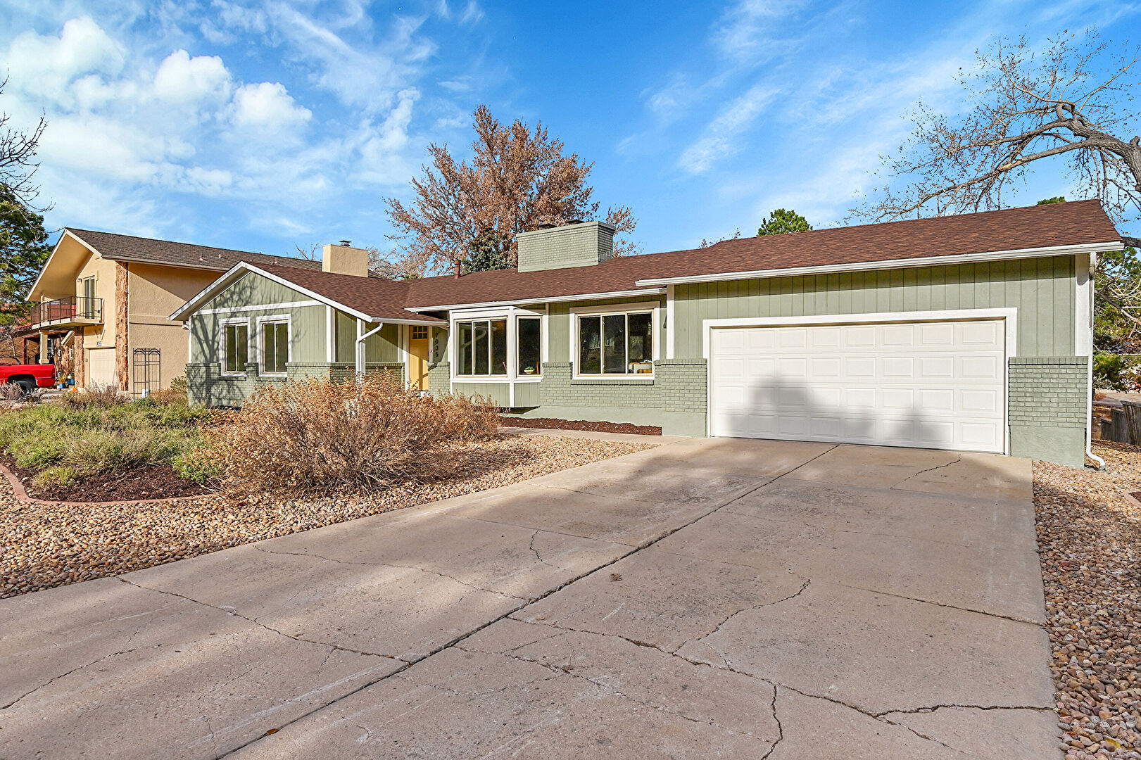 Front at 7035 Delmonico Drive, Colorado Springs, CO 80919, listed by Amanda Moss