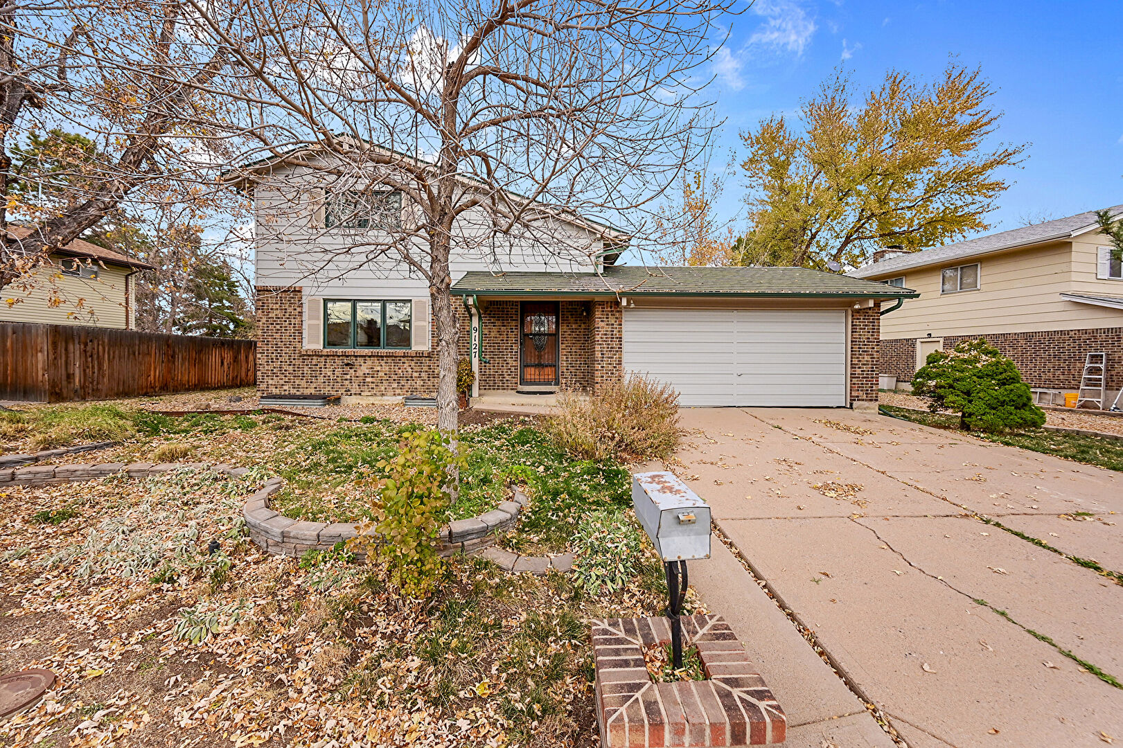 Front at 9127 West Radcliffe Drive, Littleton, CO 80123, listed by Sandy Mazarakis & Stefan Burris
