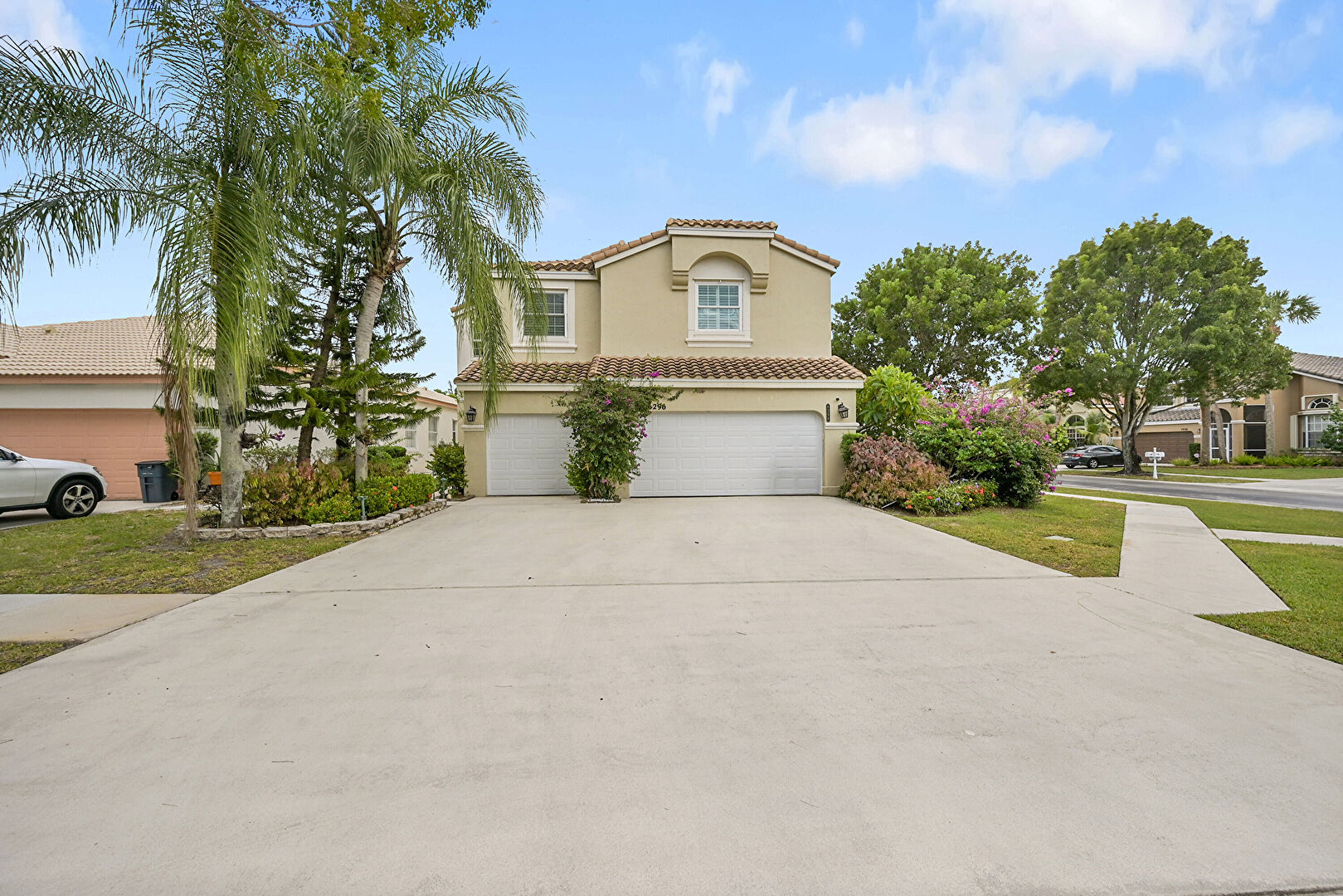 Front yard at 6296 Branchwood Drive, Lake Worth, FL 33467, listed by Nicole Pierre