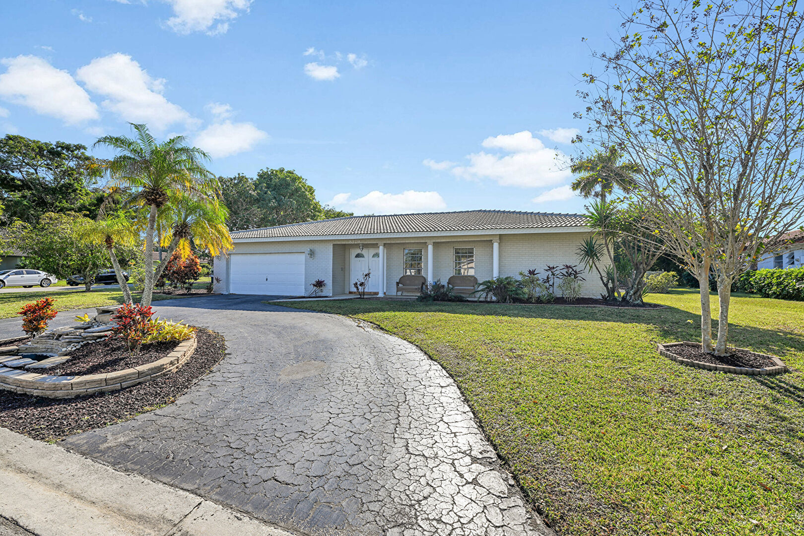 Front at 8579 Northwest 27th Drive, Coral Springs, FL 33065, listed by Keith Weiner