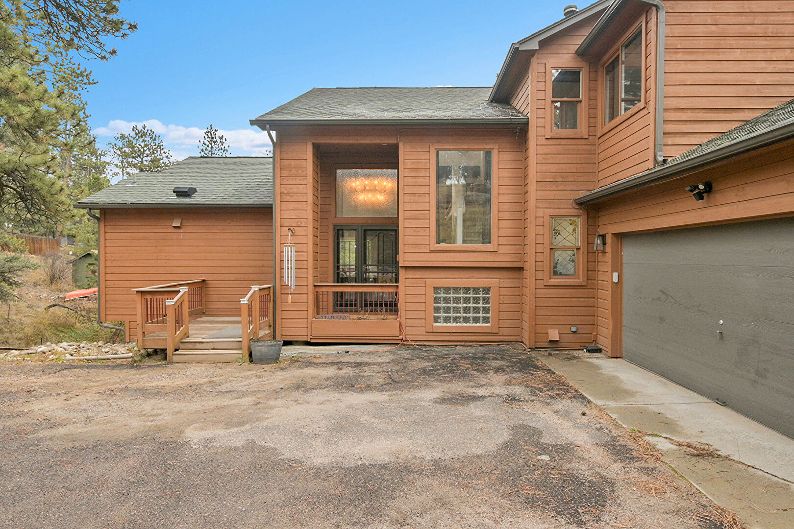 Front at 28384 Kinnikinick Road, Evergreen, CO 80439, listed by Sandra Bosworth