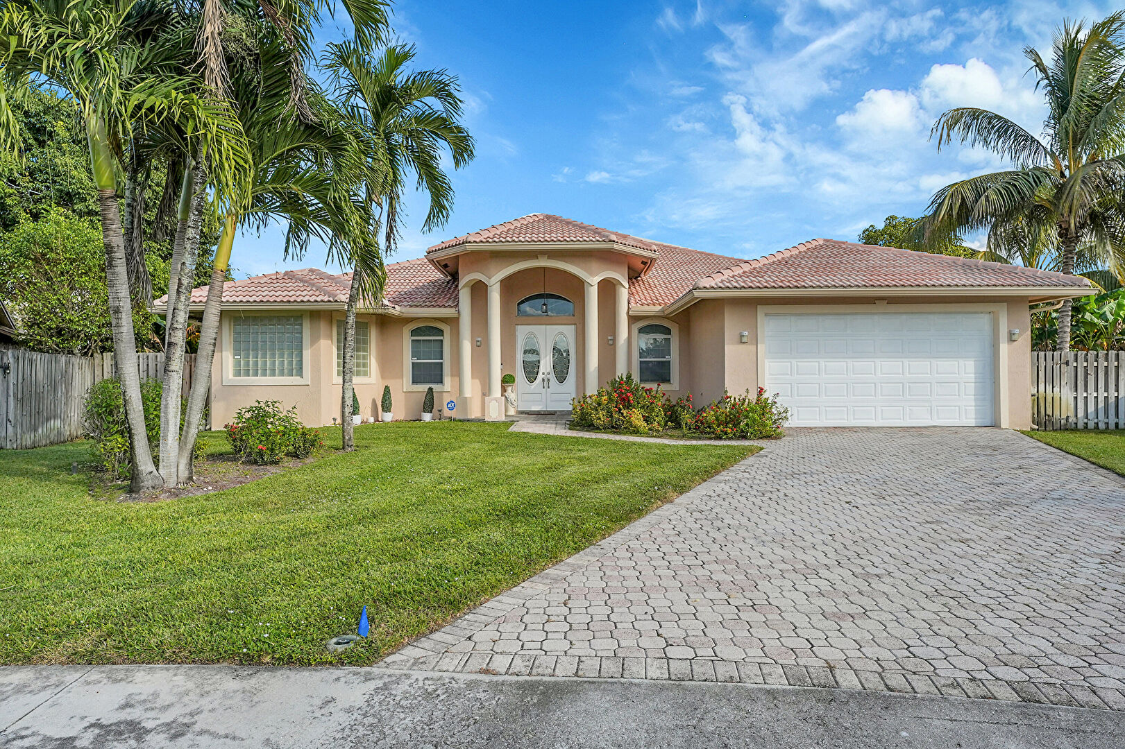 Front at 13620 Folkestone Circle, Wellington, FL 33414, listed by Becky Urbina