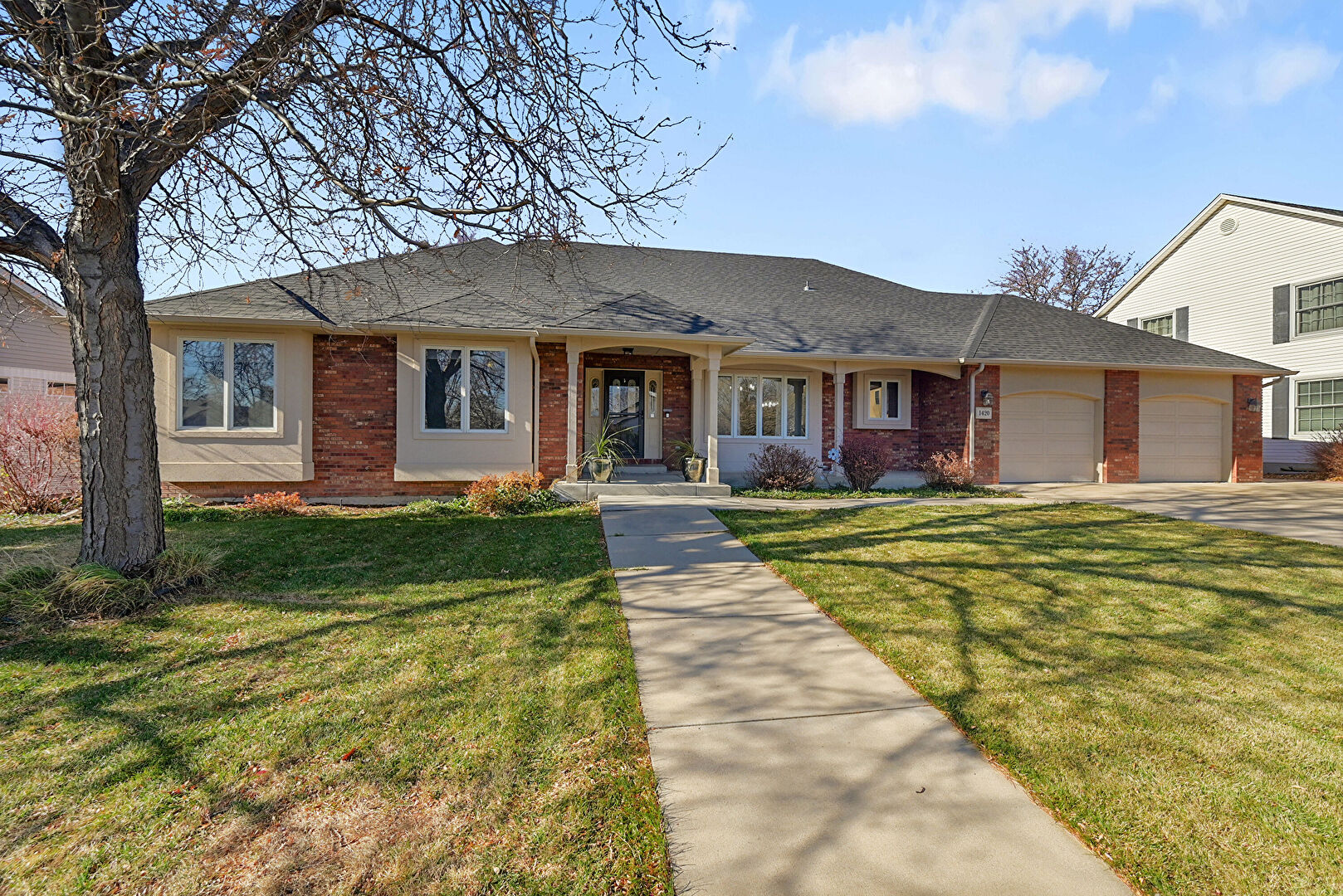 Front at 1420 Falcon Ridge Road, Eaton, CO 80615, listed by Scott & Carli Nitzel