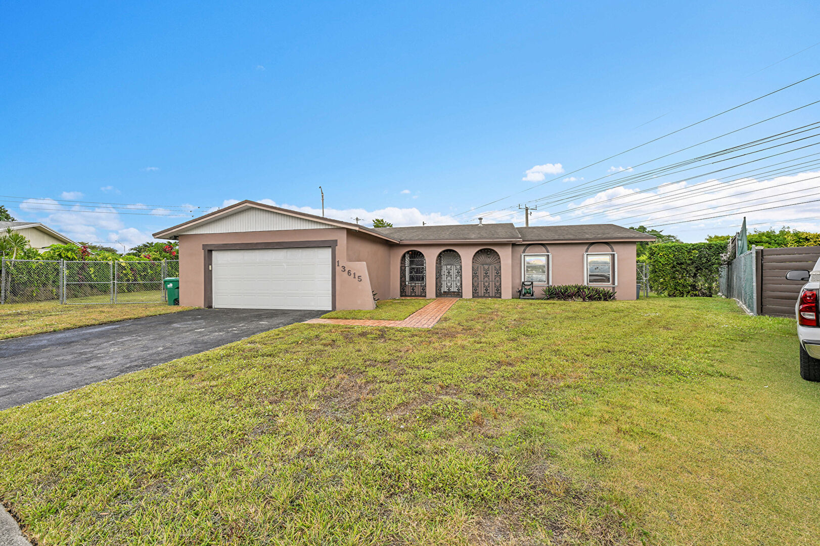 Front at 13615 Southwest 72nd Terrace, Miami, FL 33183, listed by Maxwell Pierre