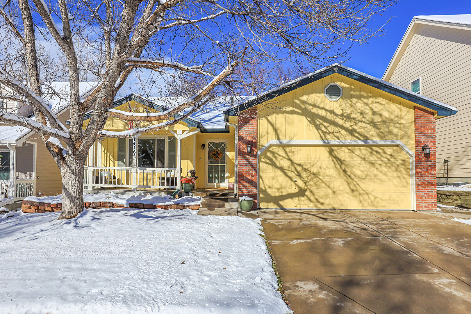 Front at 14165 West Warren Circle, Lakewood, CO 80228, listed by Trish Kelly