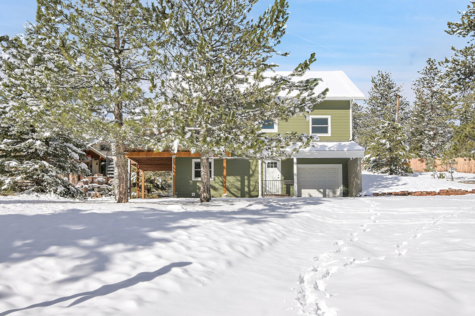 Front at 28585 Evergreen Manor Drive, Evergreen, CO 80439, listed by Sandra Bosworth