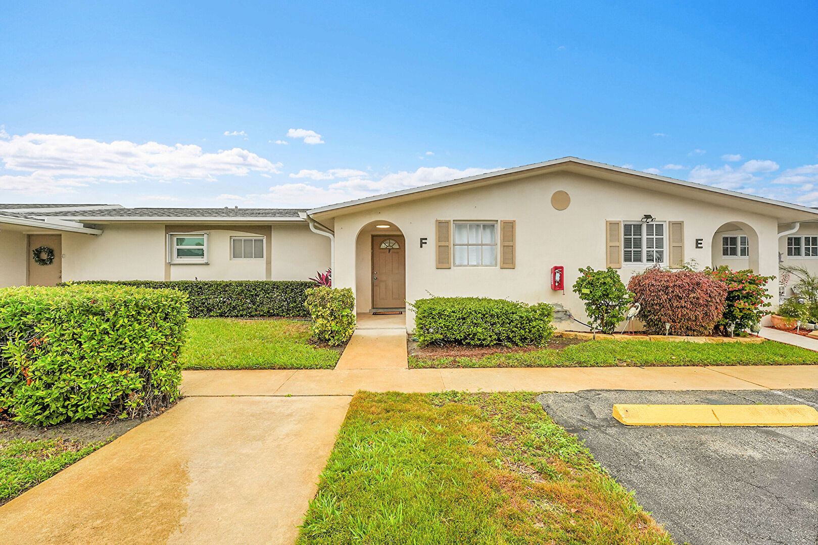 Front at 5043 Cresthaven Boulevard, Unit F, West Palm Beach, FL 33415, listed by Erica Wilcox