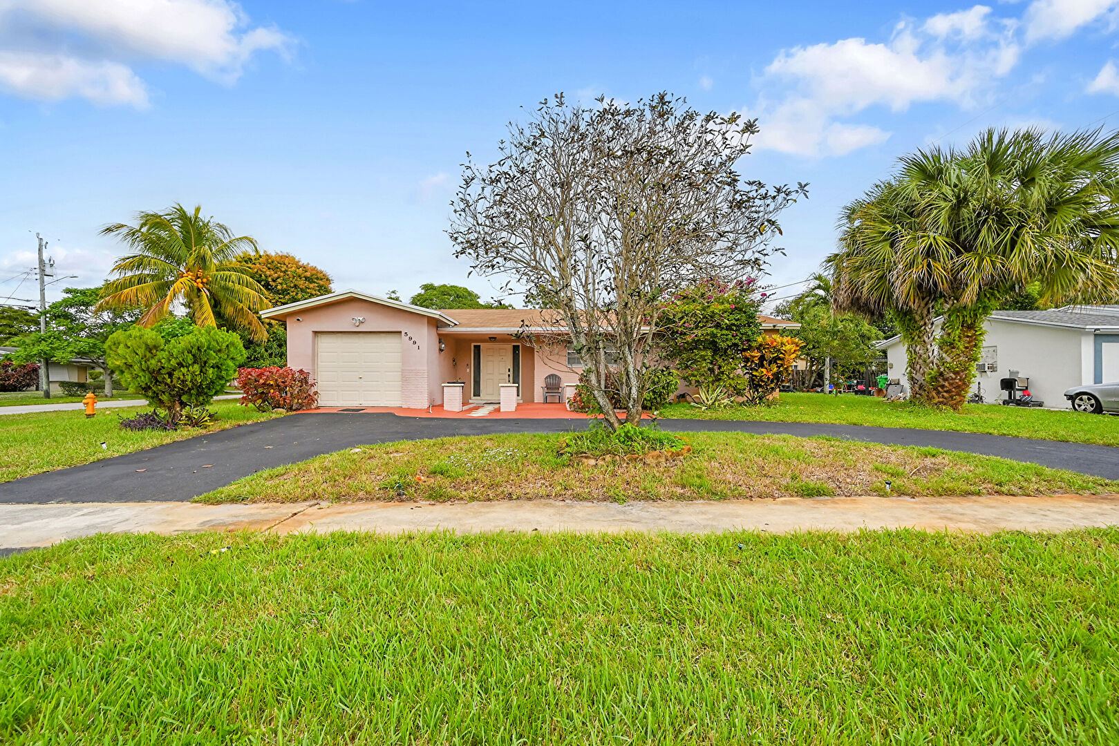 Front at 5991 Northwest 13th Street, Sunrise, FL 33313, listed by Jennifer Holmes