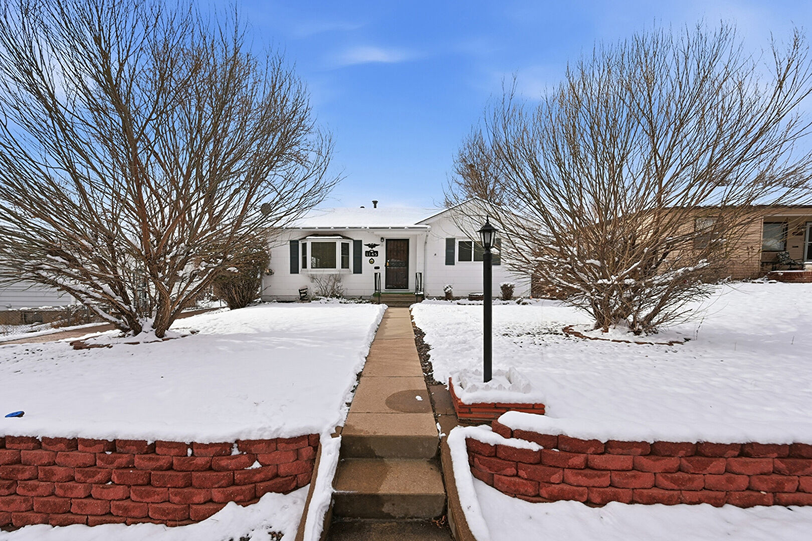 Front at 1145 South Wolff Street, Denver, CO 80219, listed by Greg Dach