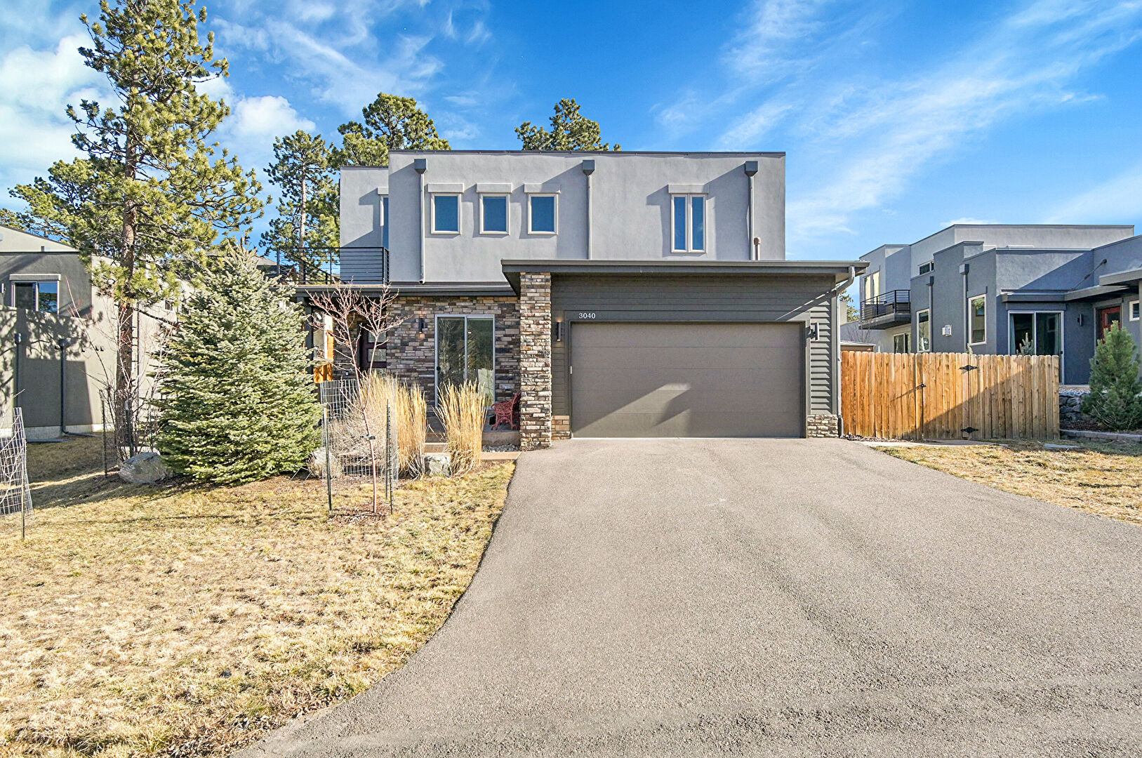 Front at 3040 Alpine Hideaway Trail, Evergreen, CO 80439, listed by Sandra Bosworth