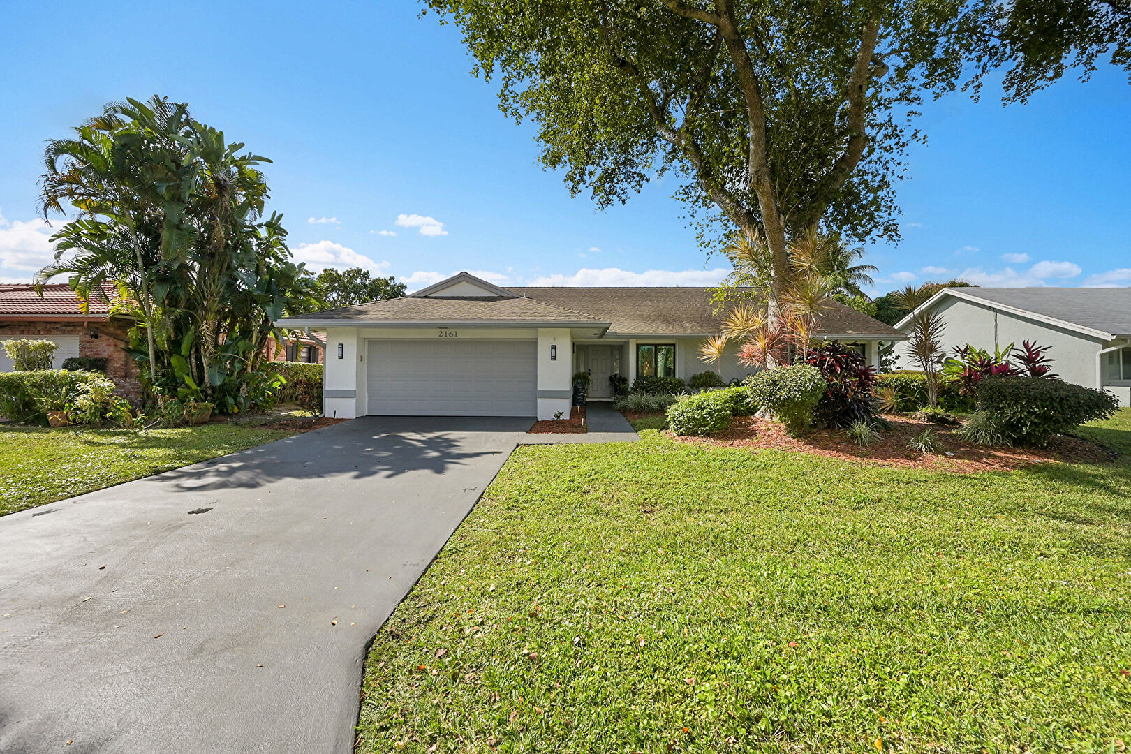 Front yard at 2161 NW 40th Ave, Coconut Creek, FL 33066, listed by Charilee Rivera