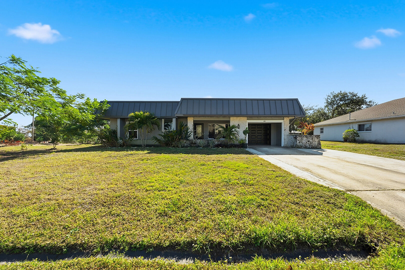 Front at 898 Southeast Evergreen Terrace, Port St. Lucie, FL 34983, listed by Jason M Coley