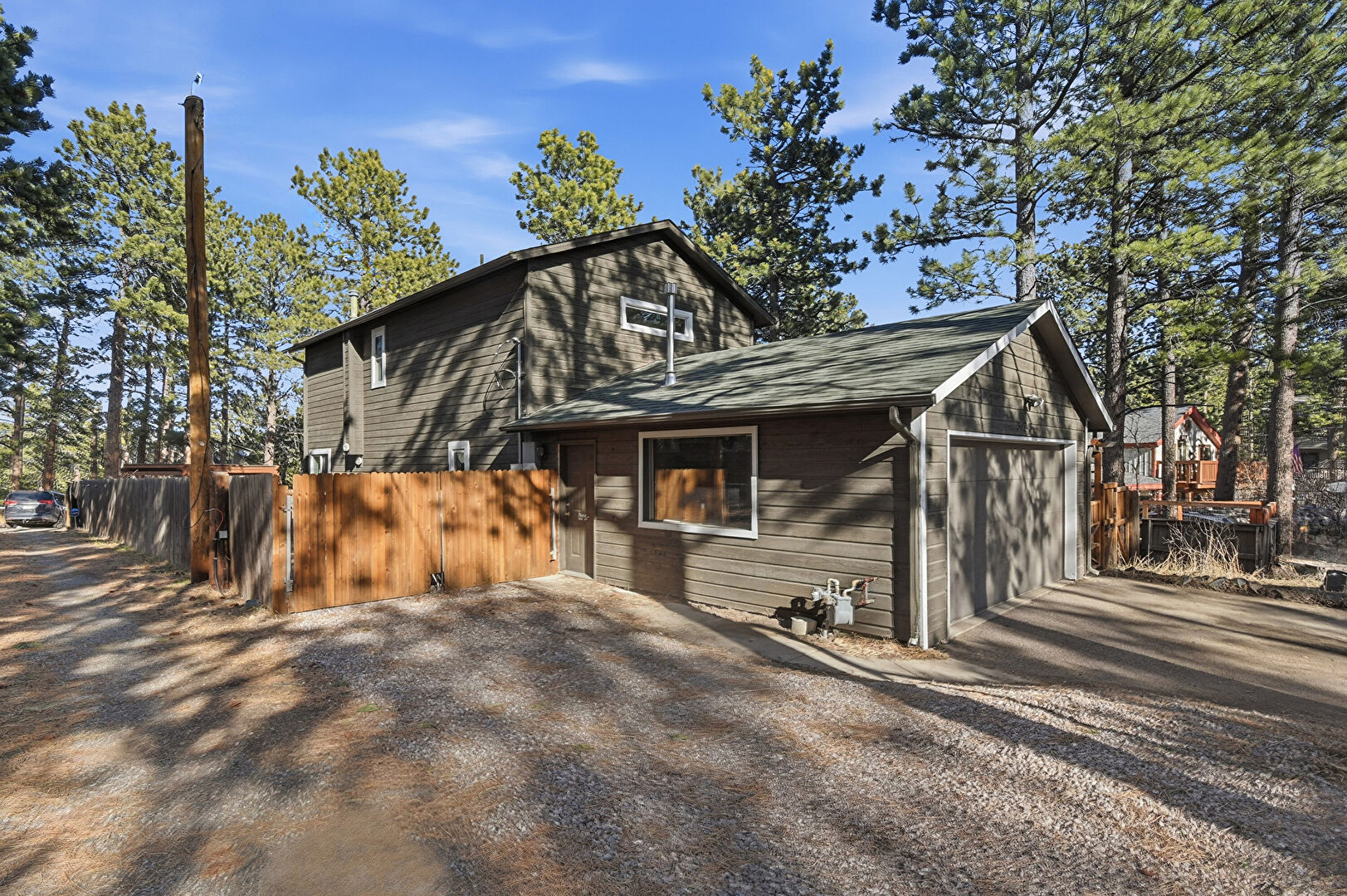 Property Exterior at 30243 Hilltop Drive, Evergreen, CO 80439, listed by Jenna and Patrick McMenaman