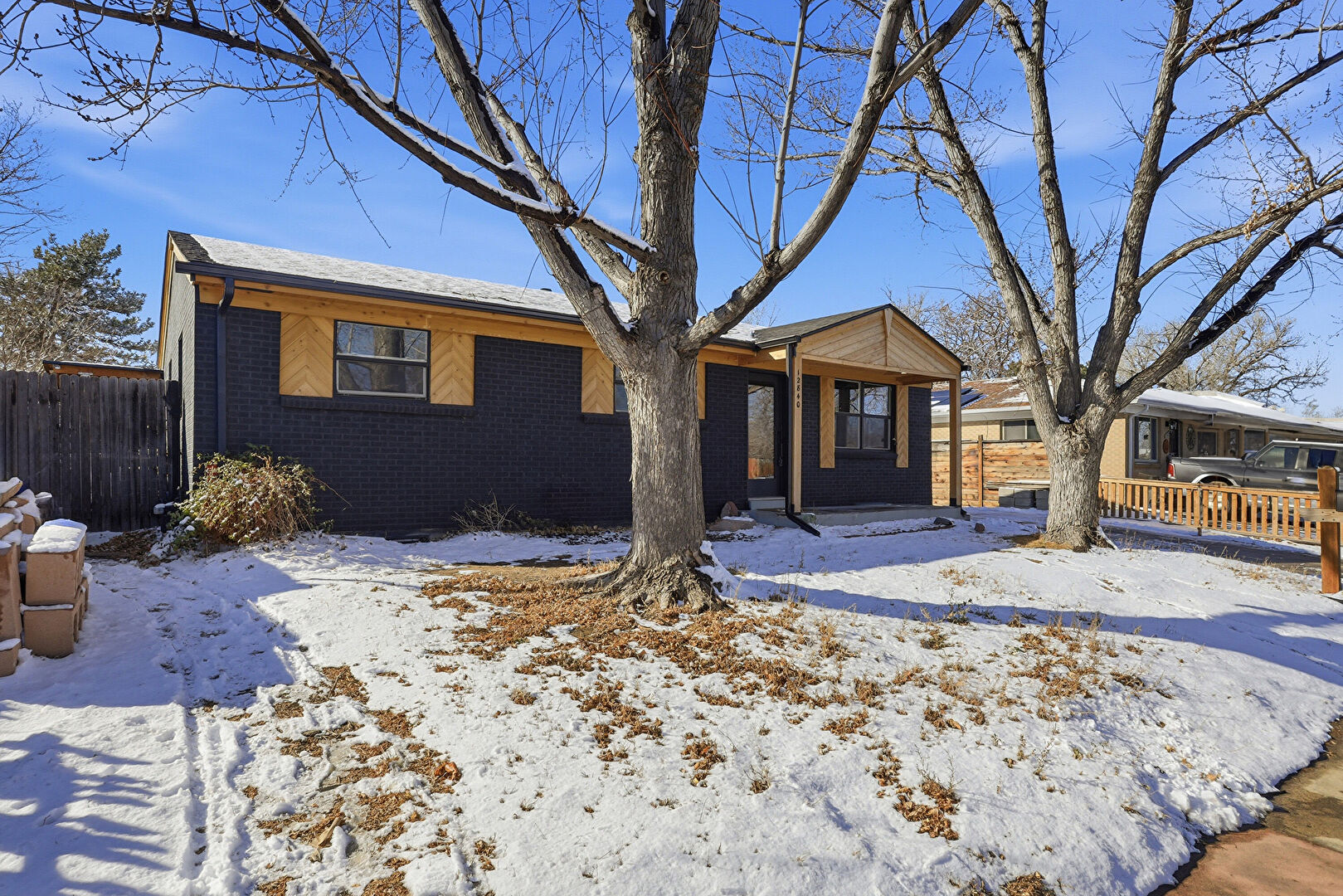Front at 12840 East 55th Avenue, Denver, CO 80239, listed by Luz Daniels