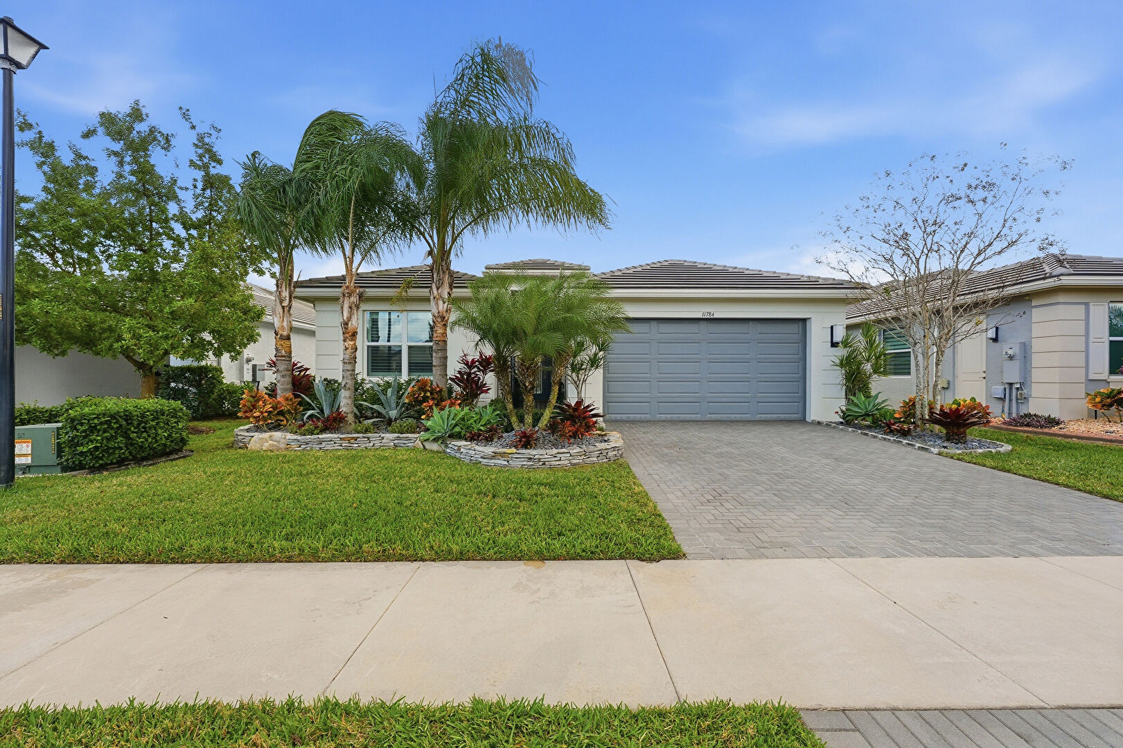 Front at 11784 Southwest Sailfish Isles Way, Port St. Lucie, FL 34987, listed by Ann Chauss