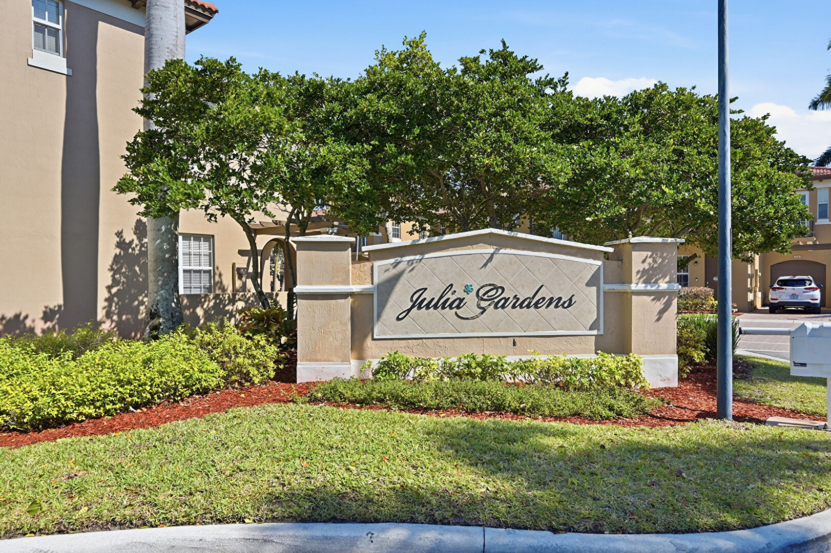 Community Sign at 6982 Julia Gardens Drive, Coconut Creek, FL 33073, listed by Laura Sanders