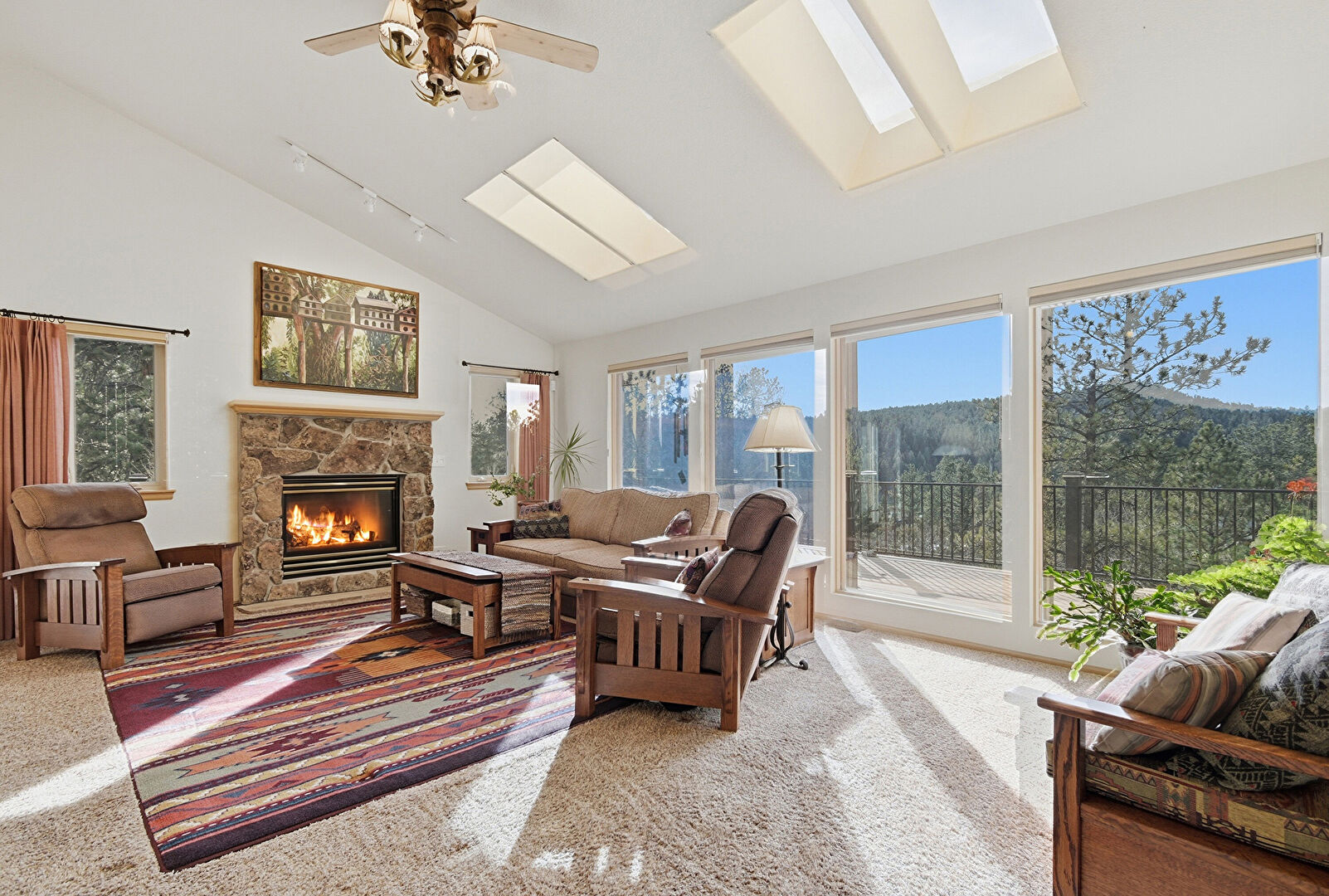 Living Room at 11864 S Stallion Dr., Pine, CO 80470, listed by Victoria Merchant