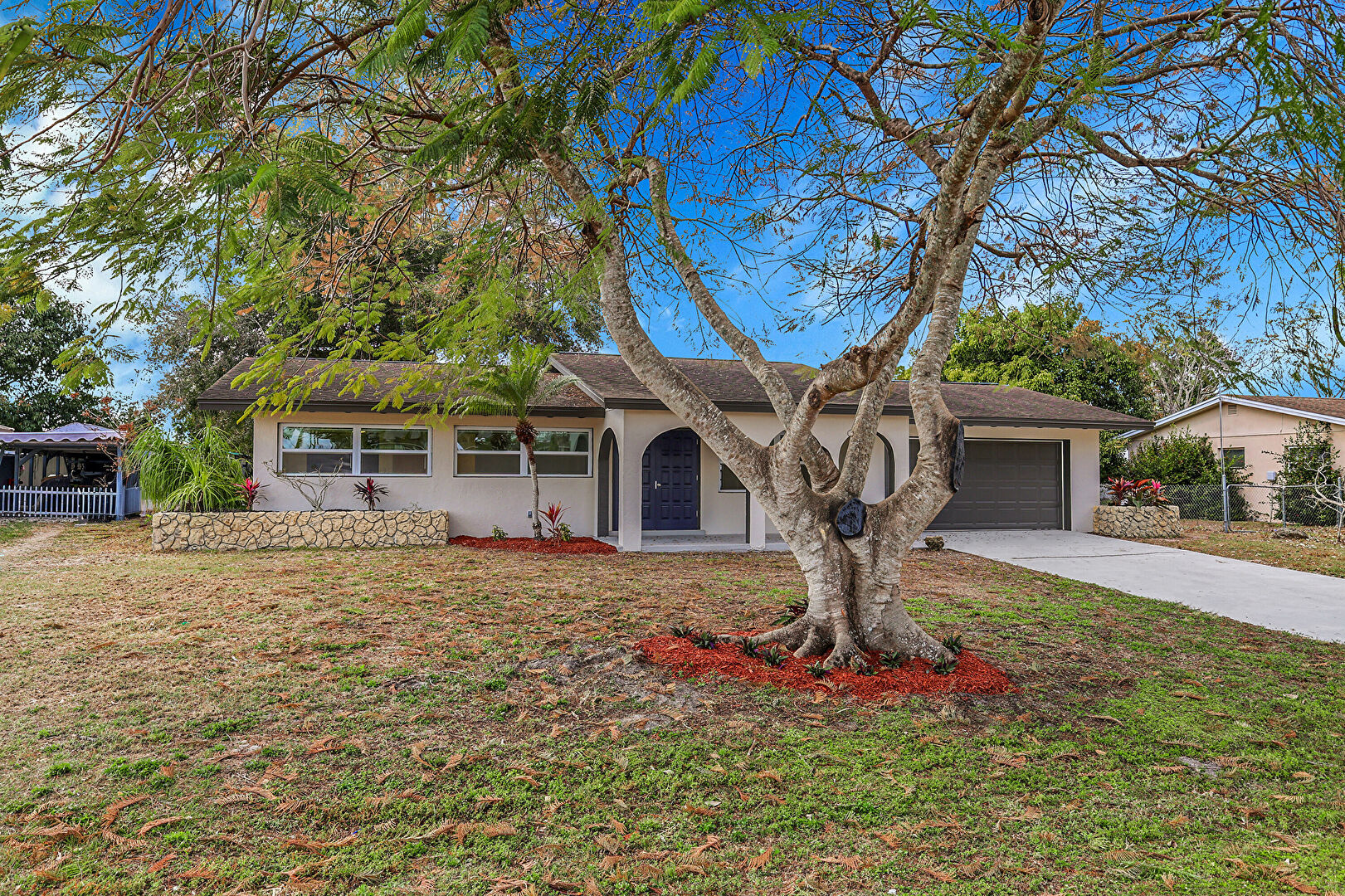 Front at 203 Lowry Avenue, Lehigh Acres, FL 33936, listed by Sherri Stoehner