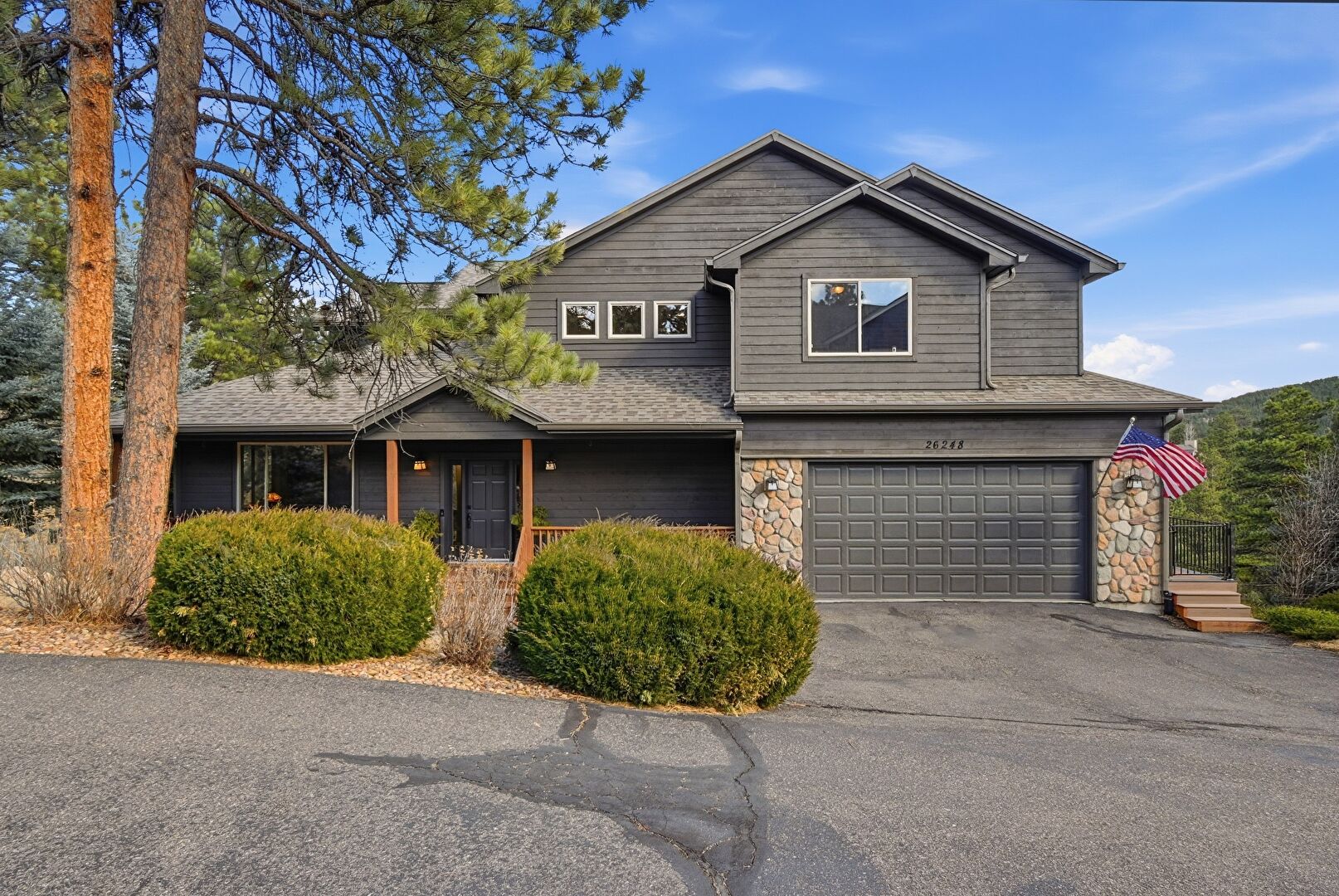 Front at 26248 Snowdrop Road, Evergreen, CO 80439, listed by Jodi Dolph