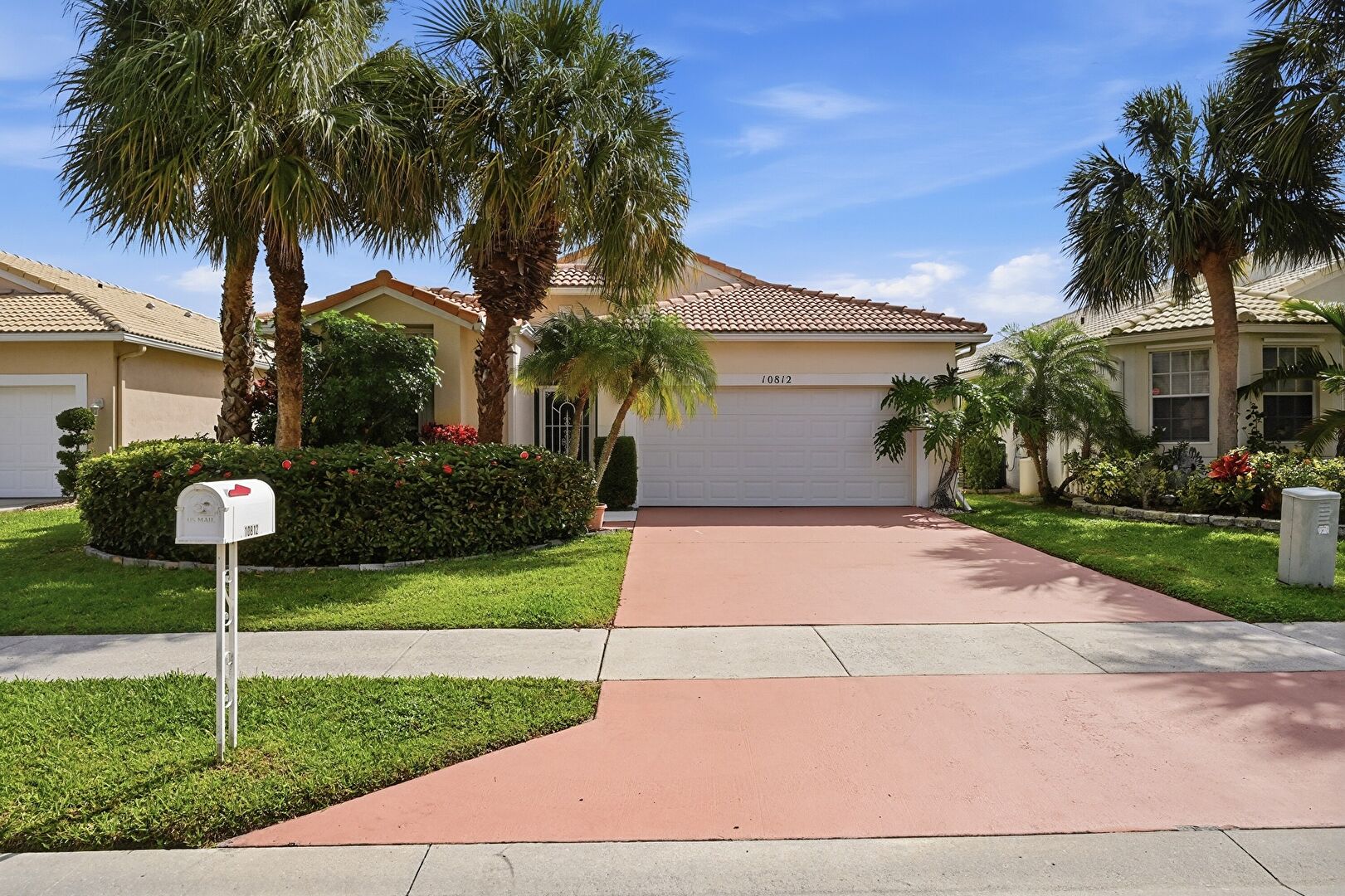Front yard at 10812 Fillmore Drive, Boynton Beach, FL 33437, listed by Abbey Adair