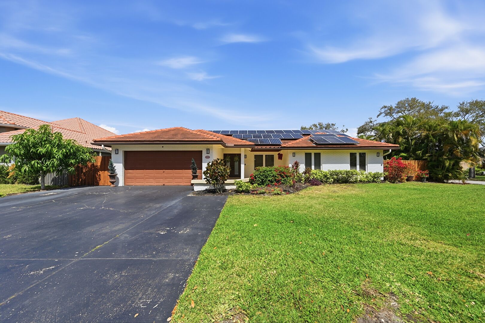 Front at 10003 Northwest 53rd Court, Coral Springs, FL 33076, listed by Jewel Johnson