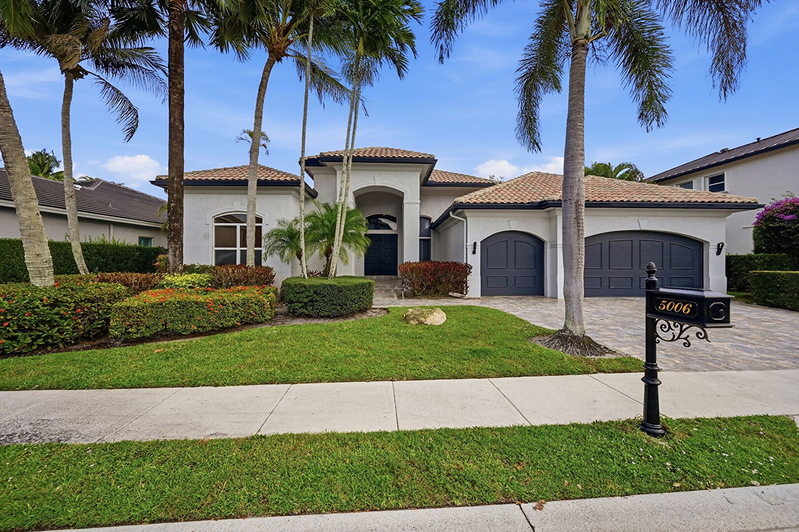 Front yard at 5006 Northwest 24th Circle, Boca Raton, FL 33431, listed by Chuck Luciano