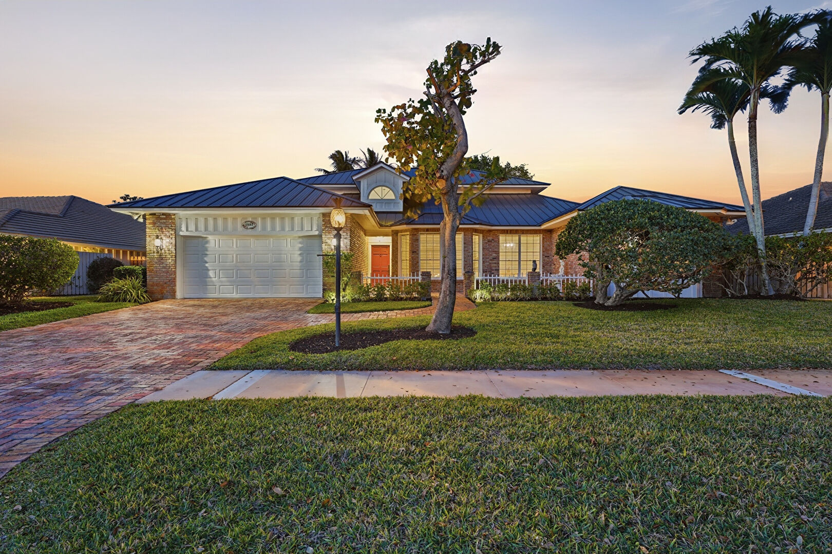 Front at 12886 La Rochelle Circle, Palm Beach Gardens, FL 33410, listed by Chris Dyer