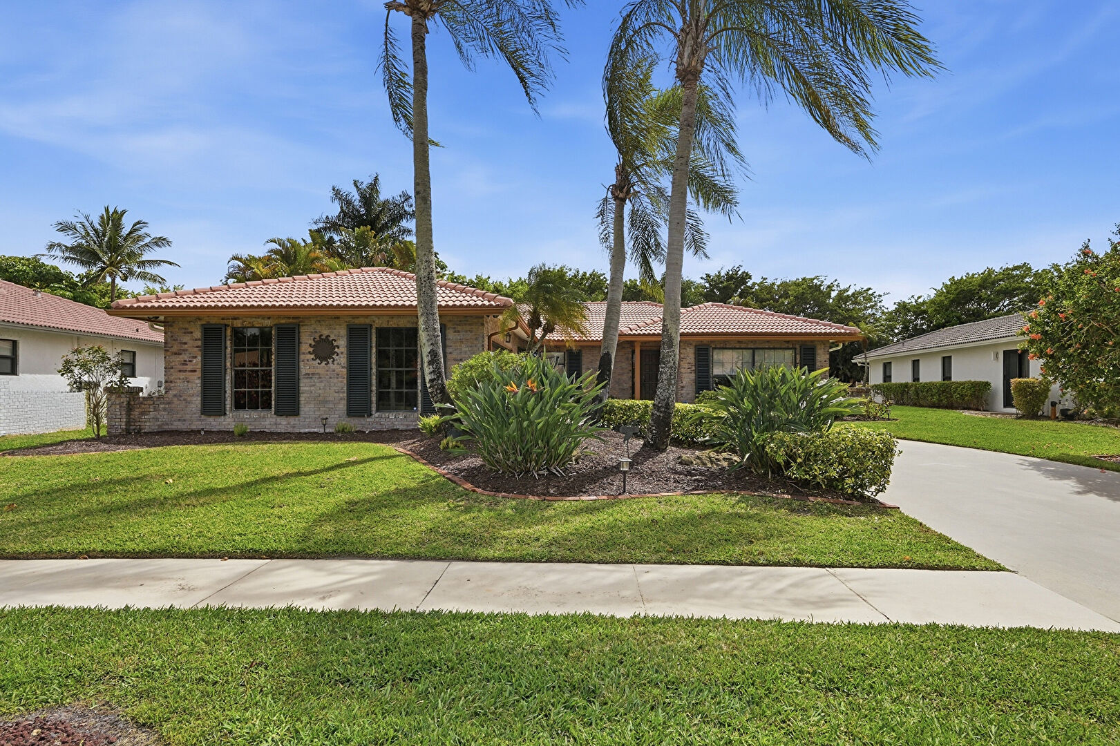 Front at 10152 Harbourtown Court, Boca Raton, FL 33498, listed by Debbi Lawlor