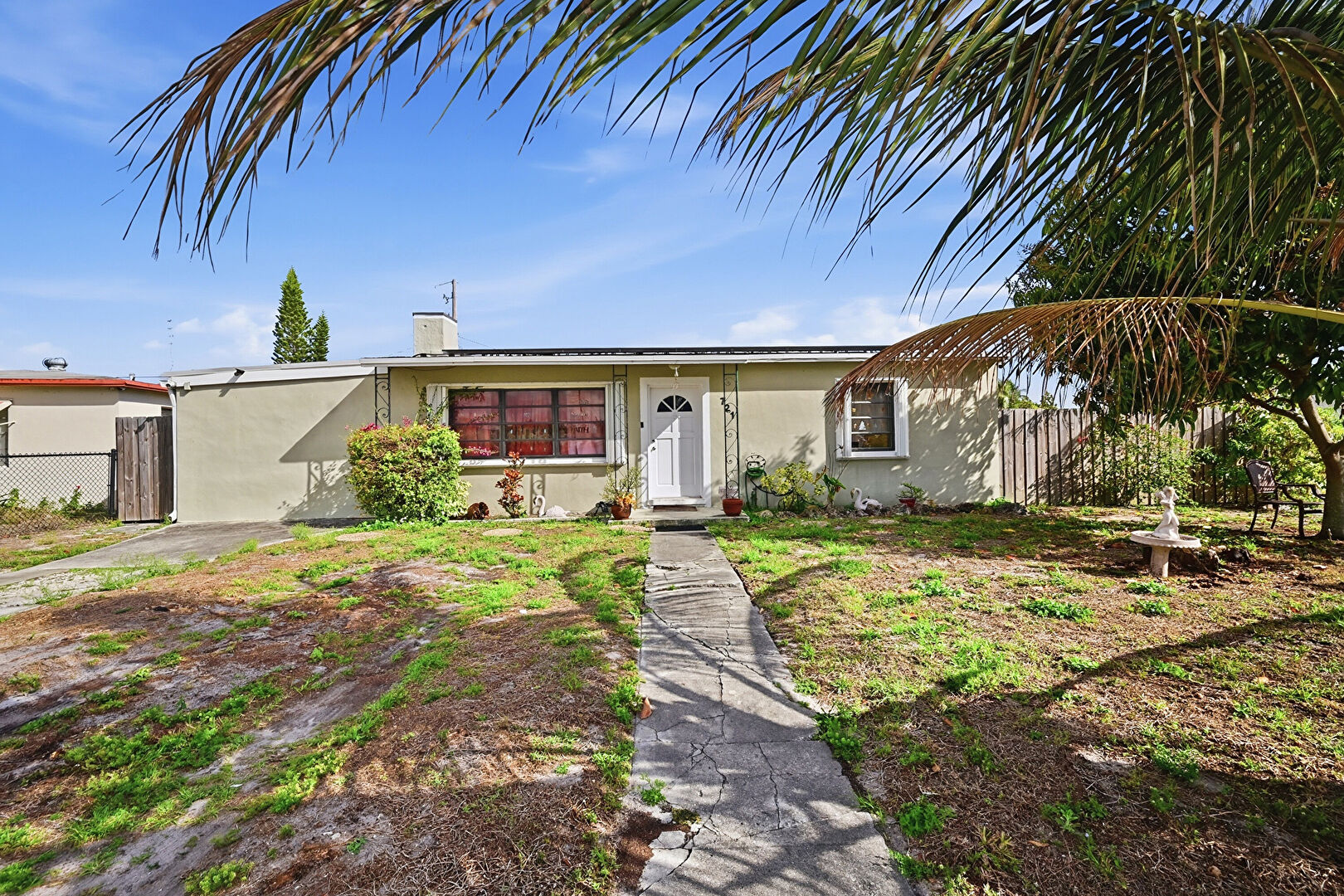 Front yard at 721 Dogwood Road, West Palm Beach, FL 33409, listed by Brendon Kromer