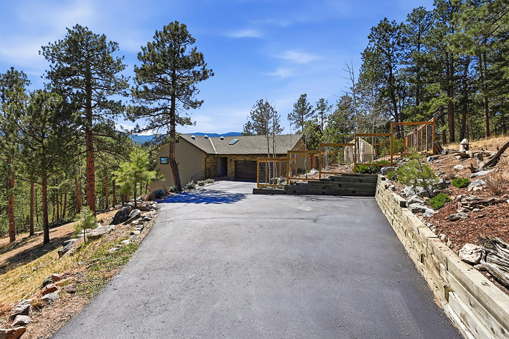 Front at 226 Bear Drive, Evergreen, CO 80439, listed by Pandora & John Erlandson