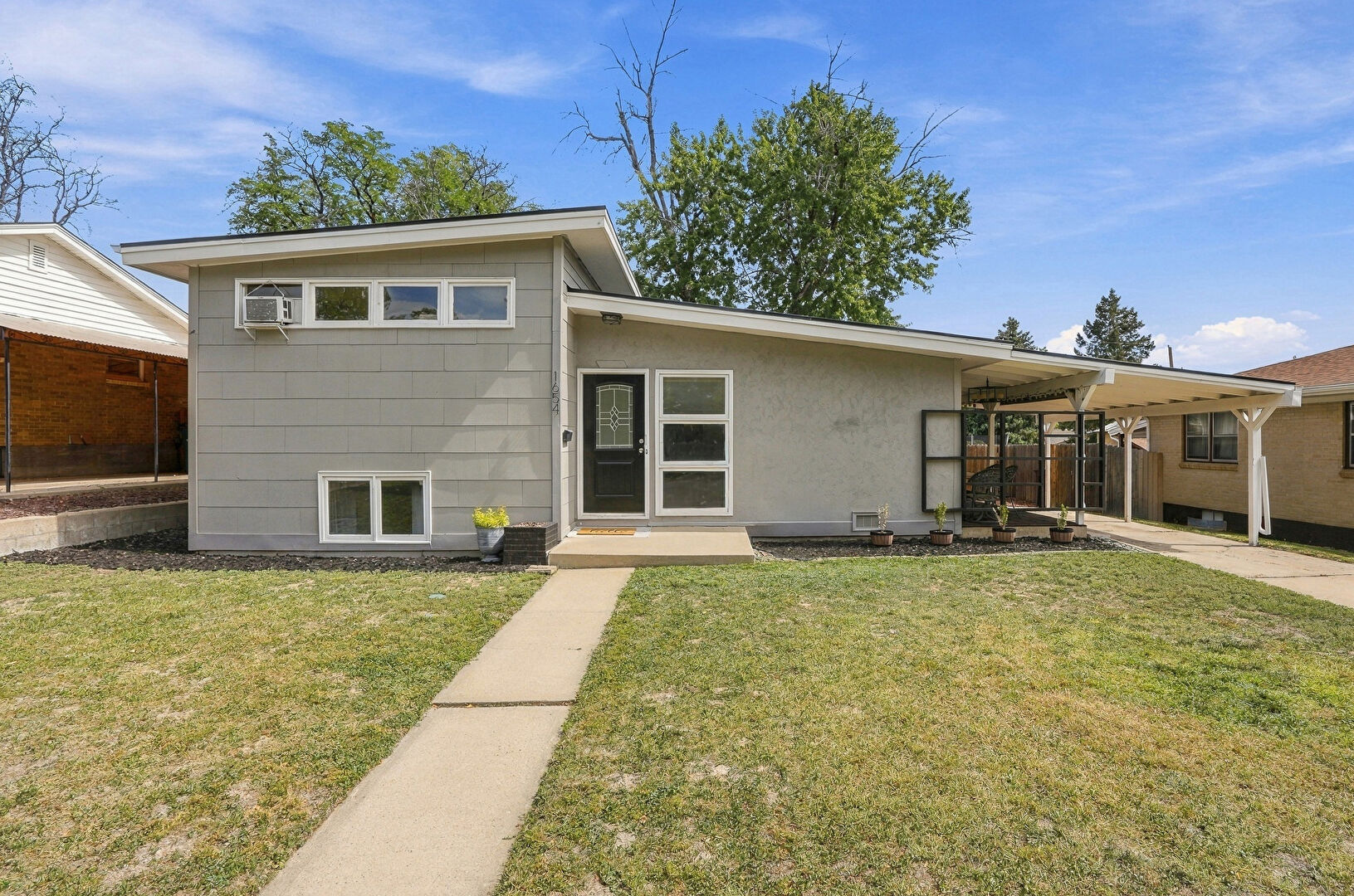 Front at 1654 South Perry Street, Denver, CO 80219, listed by Jeremiah Perry