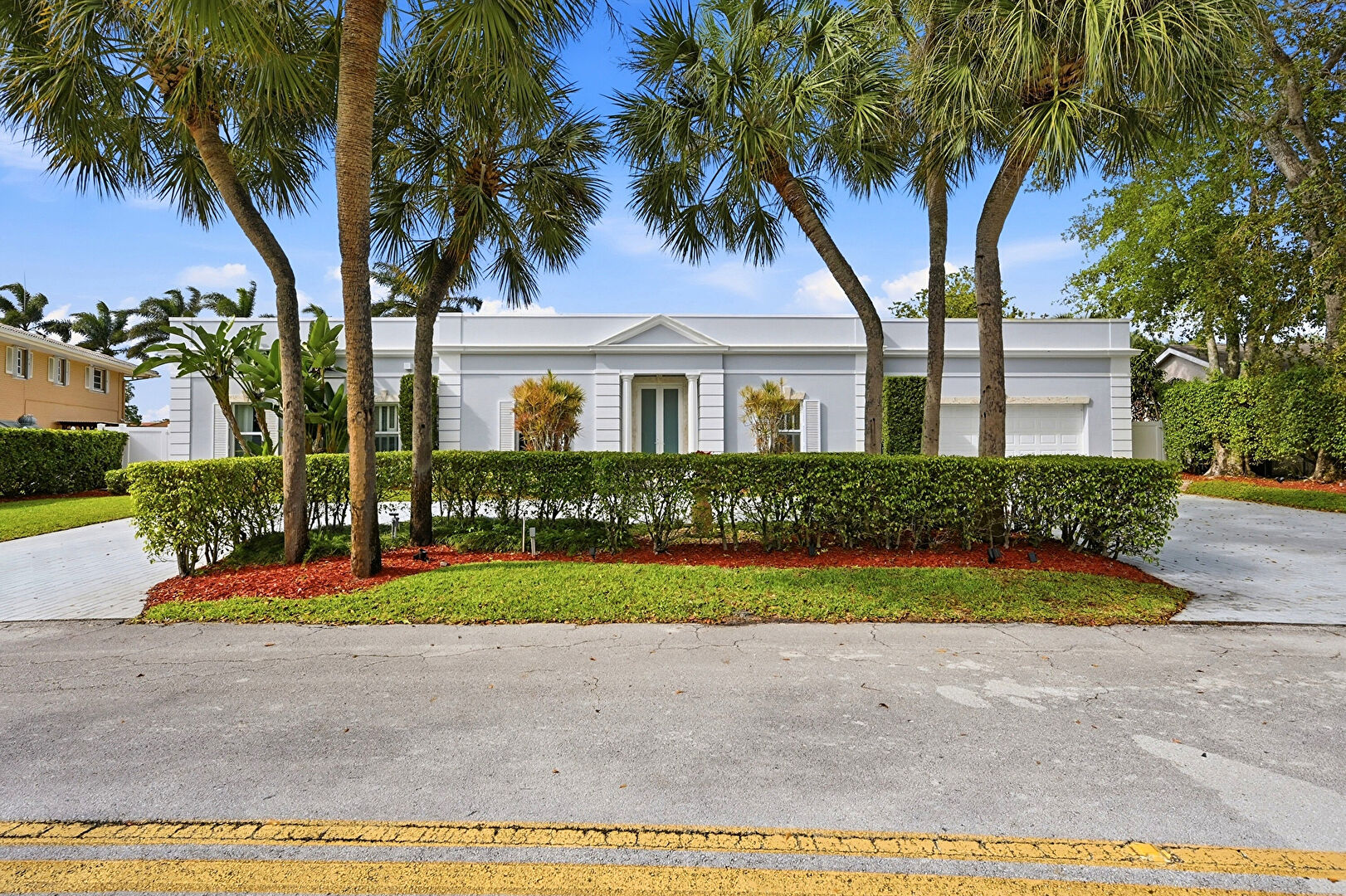Front at 9001 North Lake Dasha Drive, Plantation, FL 33324, listed by Laura Sanders