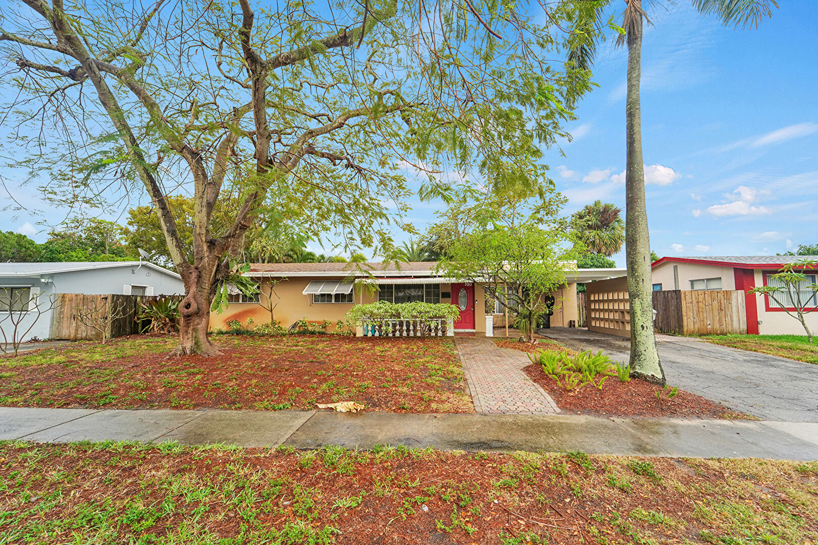 Front at 720 NE 23 Place, Pompano Beach, FL 33064, listed by David Phelps