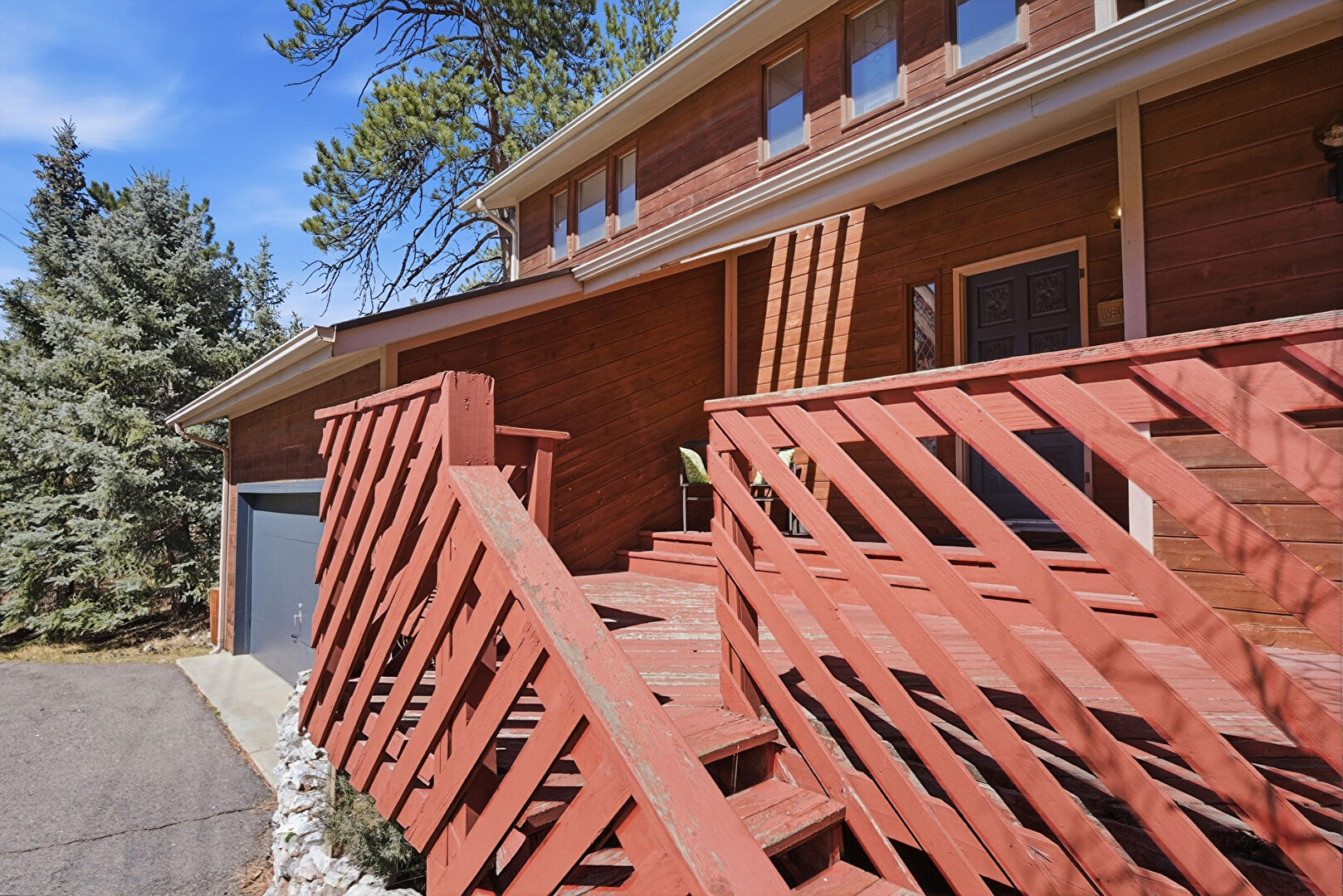 Front at 27569 Fireweed Drive, Evergreen, CO 80439, listed by Jenna and Patrick McMenaman