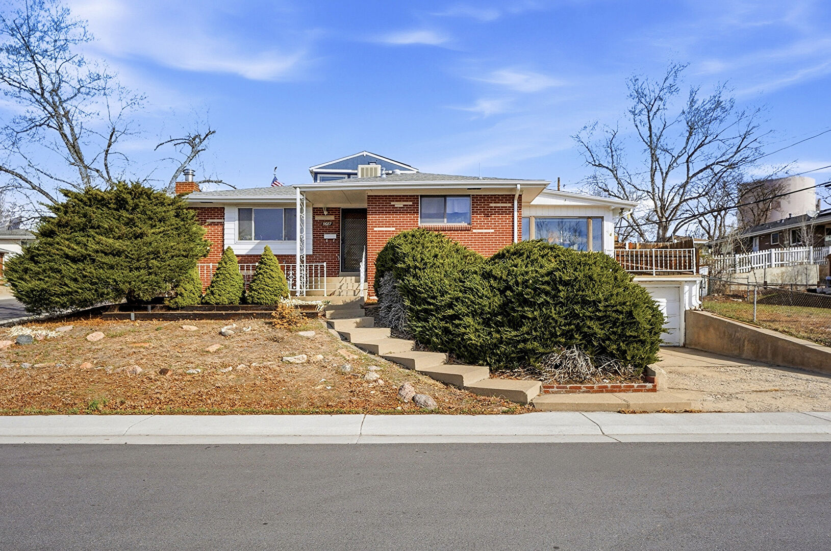 Front at 5687 West 65th Avenue, Arvada, CO 80003, listed by Chris Greenburg