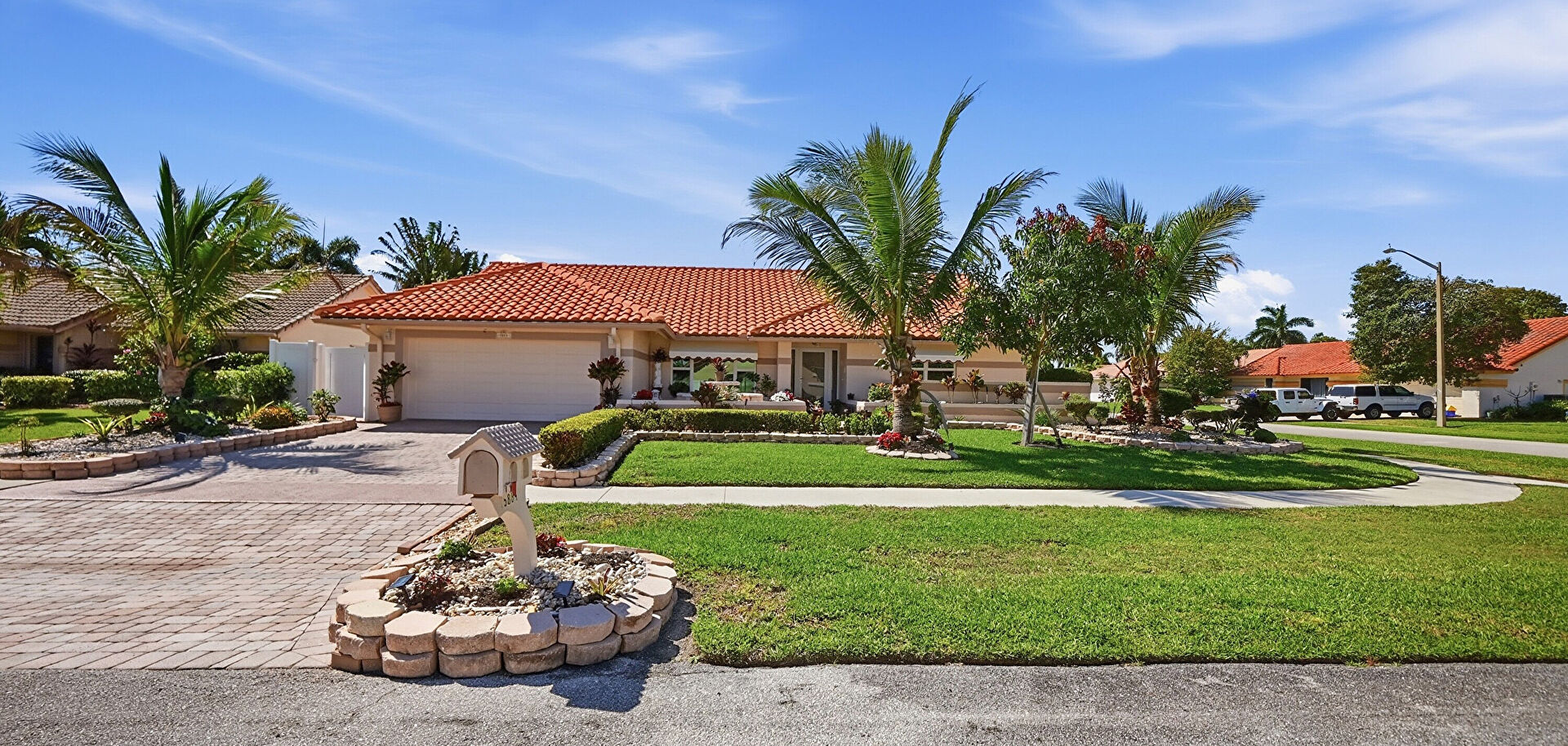 Front yard at 5884 Laurel Green Circle, Boynton Beach, FL 33437, listed by Francesco Spagnuolo