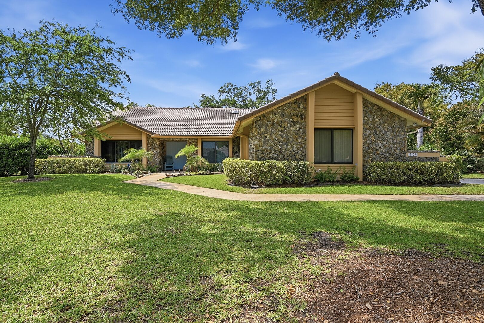 Front at 9127 Northwest 51st Place, Coral Springs, FL 33067, listed by Vincent Gubitosi