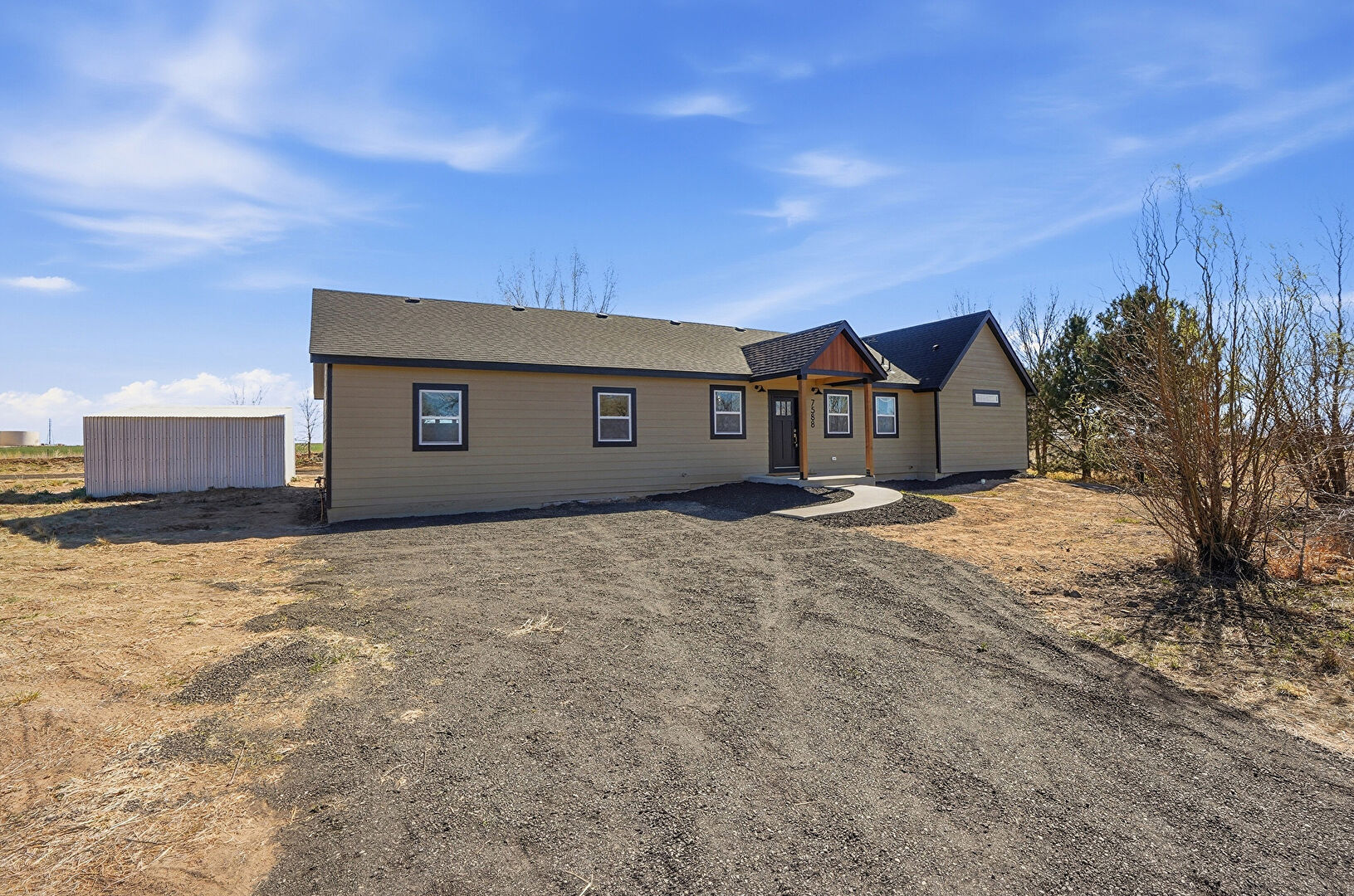 Front at 7588 County Road 16, Frederick, CO 80530, listed by Robert Gruber