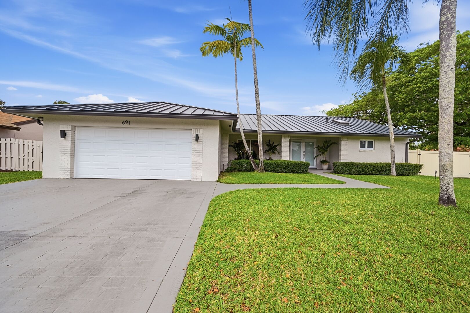 Front at 691 Blue Ridge Way, Davie, FL 33325, listed by Milagros Vasquez 