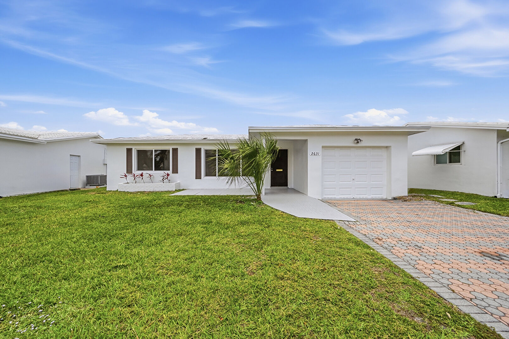 Front at 2631 West Golf Boulevard, Pompano Beach, FL 33064, listed by Laura Sanders