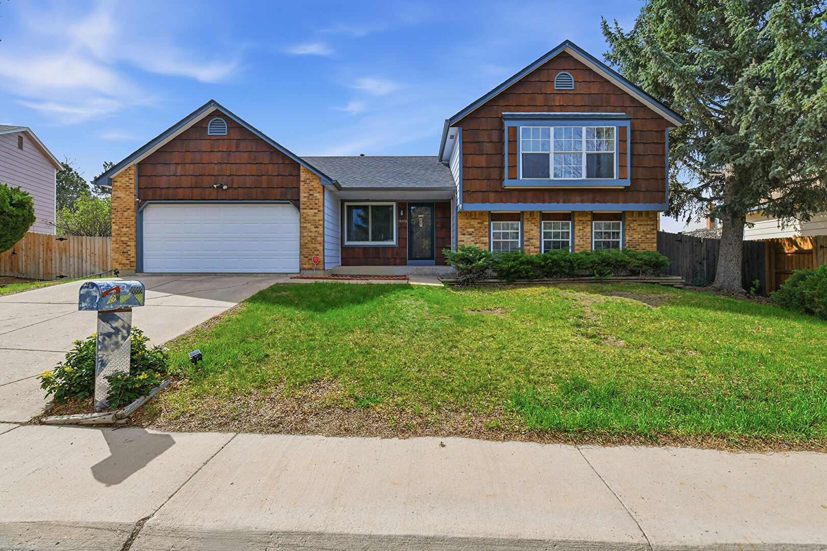 Front at 16258 East Exposition Drive, Aurora, CO 80017, listed by Mike & Ed Hardey