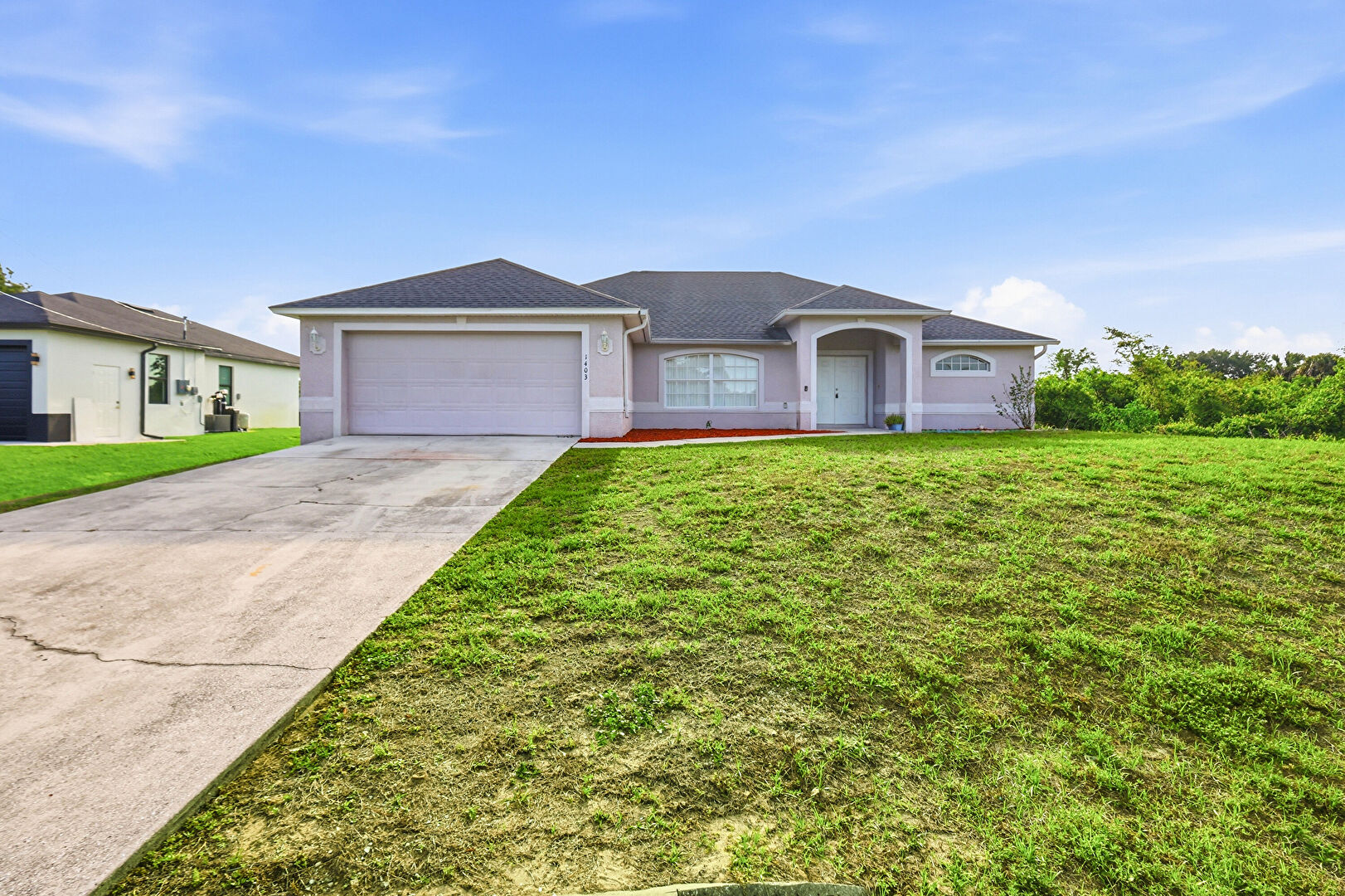 Front at 1403 Curtis Avenue South, Lehigh Acres, FL 33976, listed by Betty Leathers