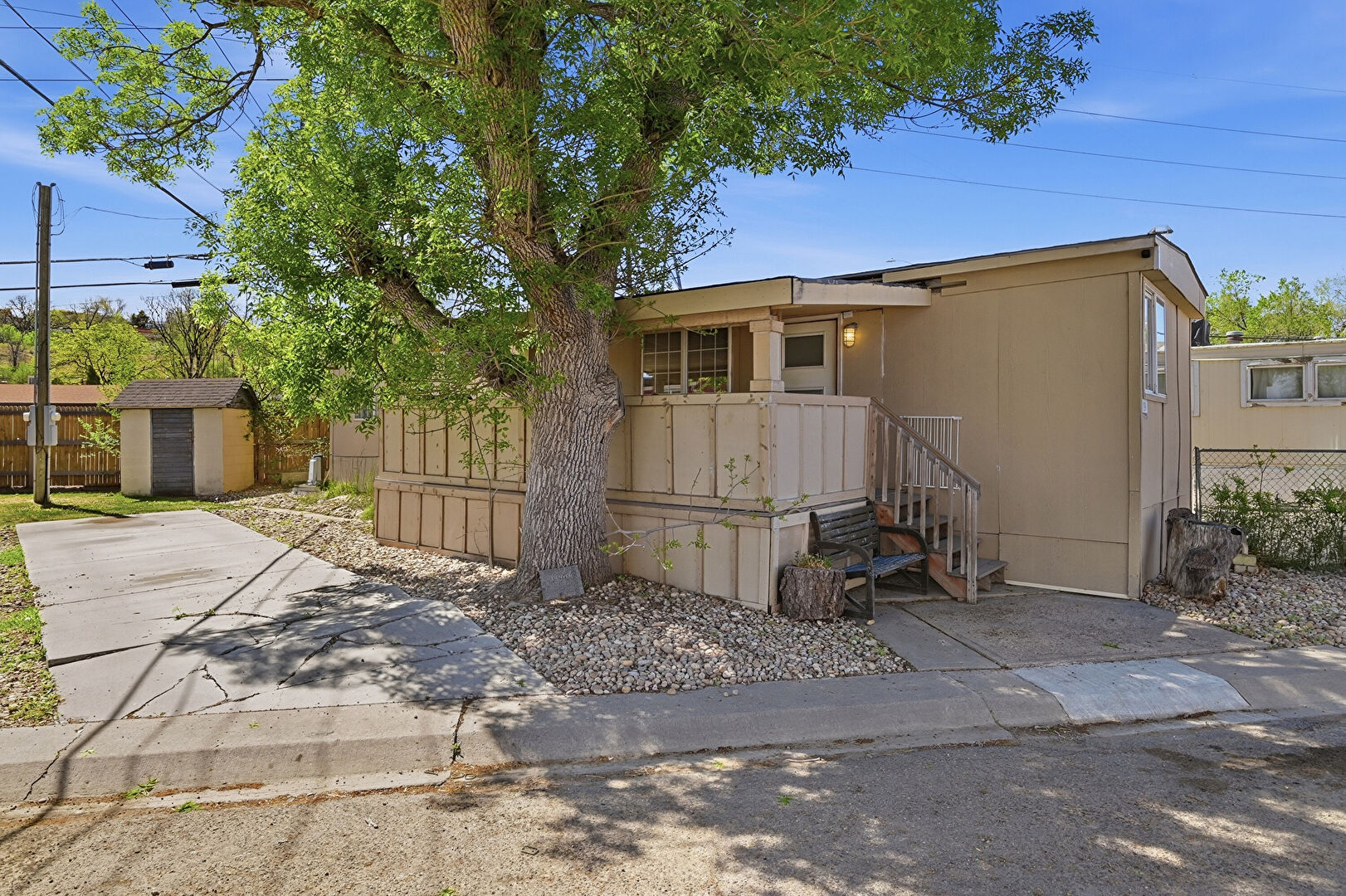 Front at 5250 West 53rd Avenue, Lot 89, Arvada, CO 80002, listed by Nubia Cereceres