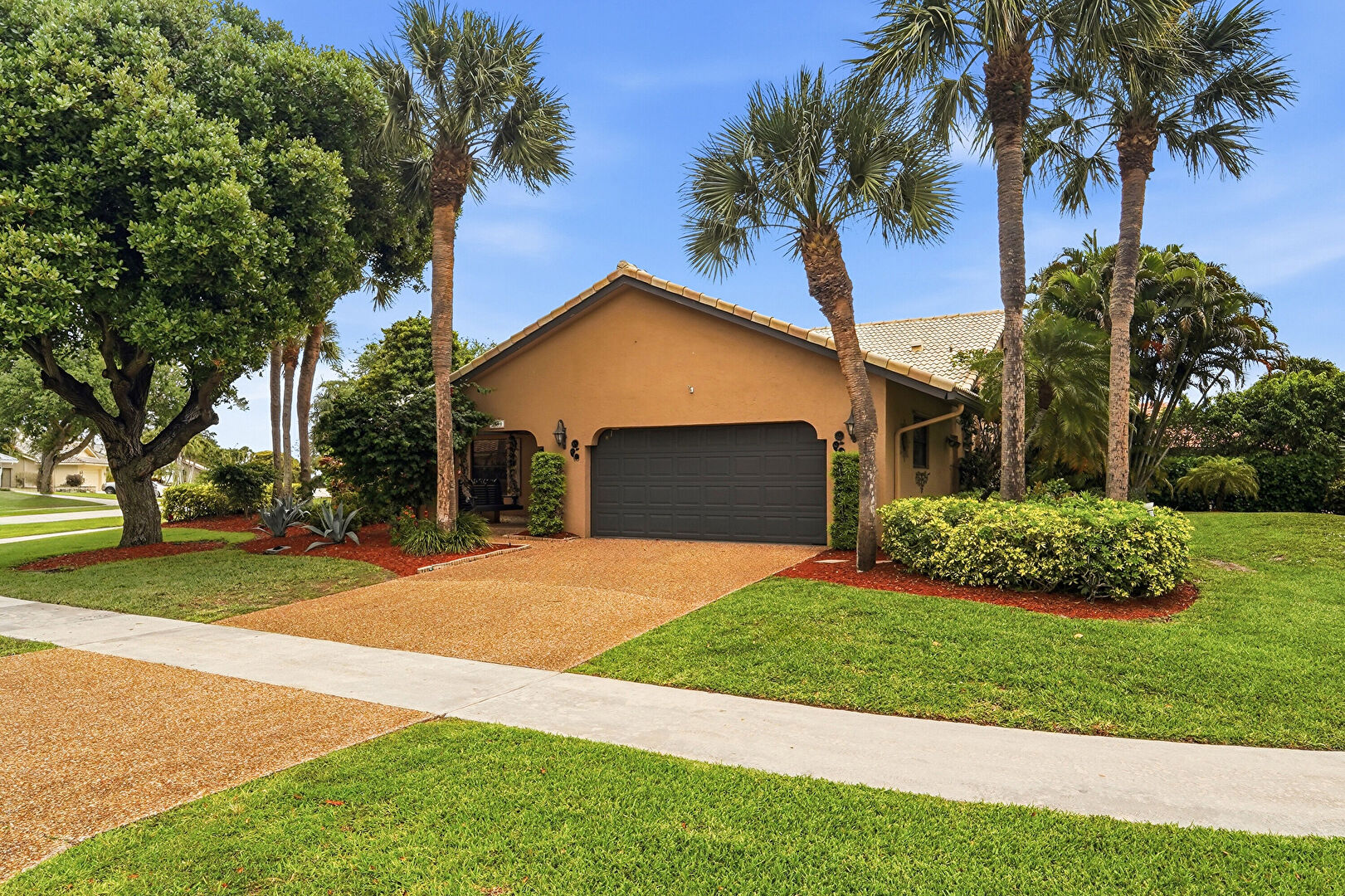 Front at 2490 Lob Lolly Lane, Deerfield Beach, FL 33442, listed by Tricia Oliver Smith