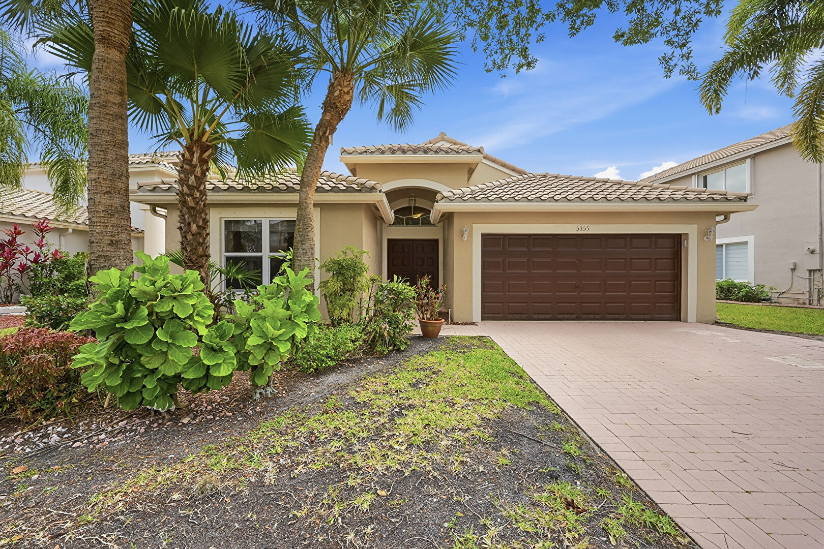 Front at 5355 Northwest 122nd Drive, Coral Springs, FL 33076, listed by Einat Steinberg