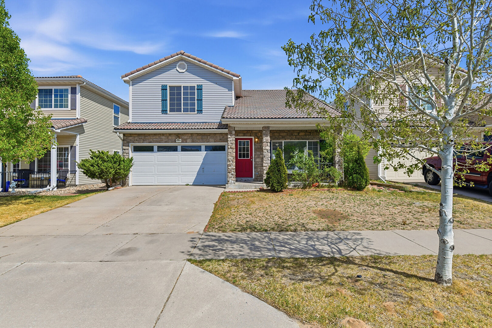 Front at 4864 North Genoa Street, Denver, CO 80249, listed by Jessica Kuhn